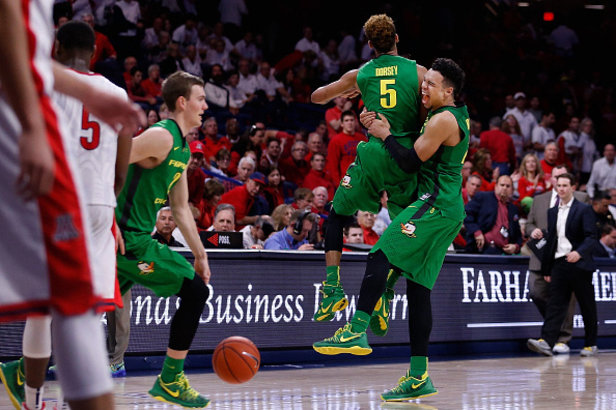 TUCSON, AZ - JANUARY 28:  Dillon Brooks #24 and Tyler Dorsey #5 of the Oregon Ducks celebrate after defeating the Arizona Wildcats in the college basketball game at McKale Center on January 28, 2016 in Tucson, Arizona. The Ducks defeated the Wildcats 83-7