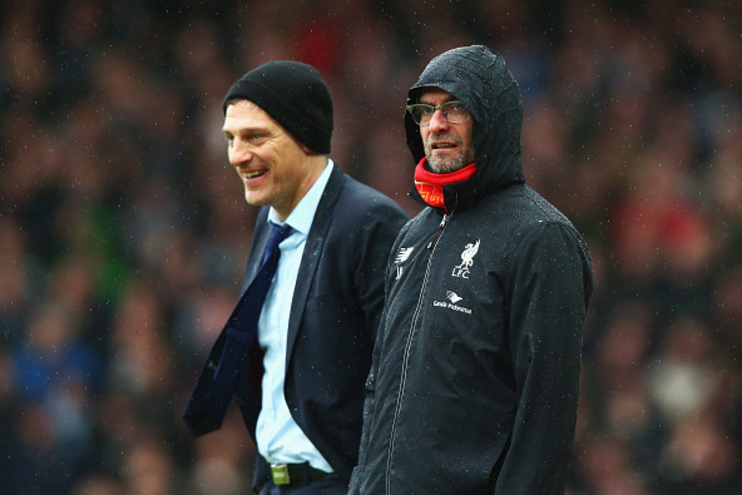 LONDON, ENGLAND - JANUARY 02: Slaven Bilic (L) manager of West Ham United and Jurgen Klopp (R) manager of Liverpool are seen during the Barclays Premier League match between West Ham United and Liverpool at Boleyn Ground on January 2, 2016 in London, Engl