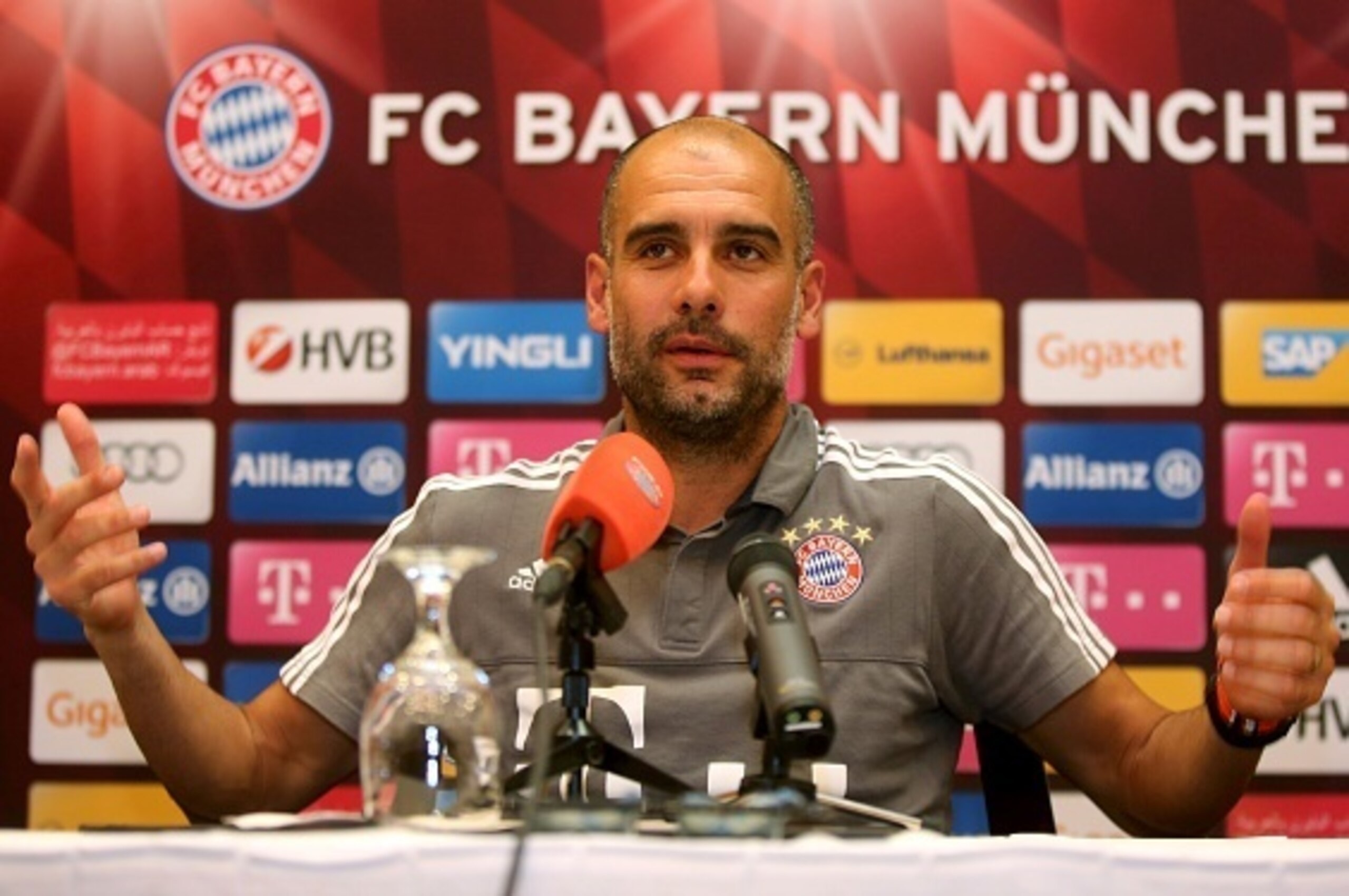 Bayern Munich's Spanish head coach Pep Guardiola speaks during a press conference at Aspire Academ in the Qatari capital Doha on January 11, 2016. / AFP / STRINGER        (Photo credit should read STRINGER/AFP/Getty Images)