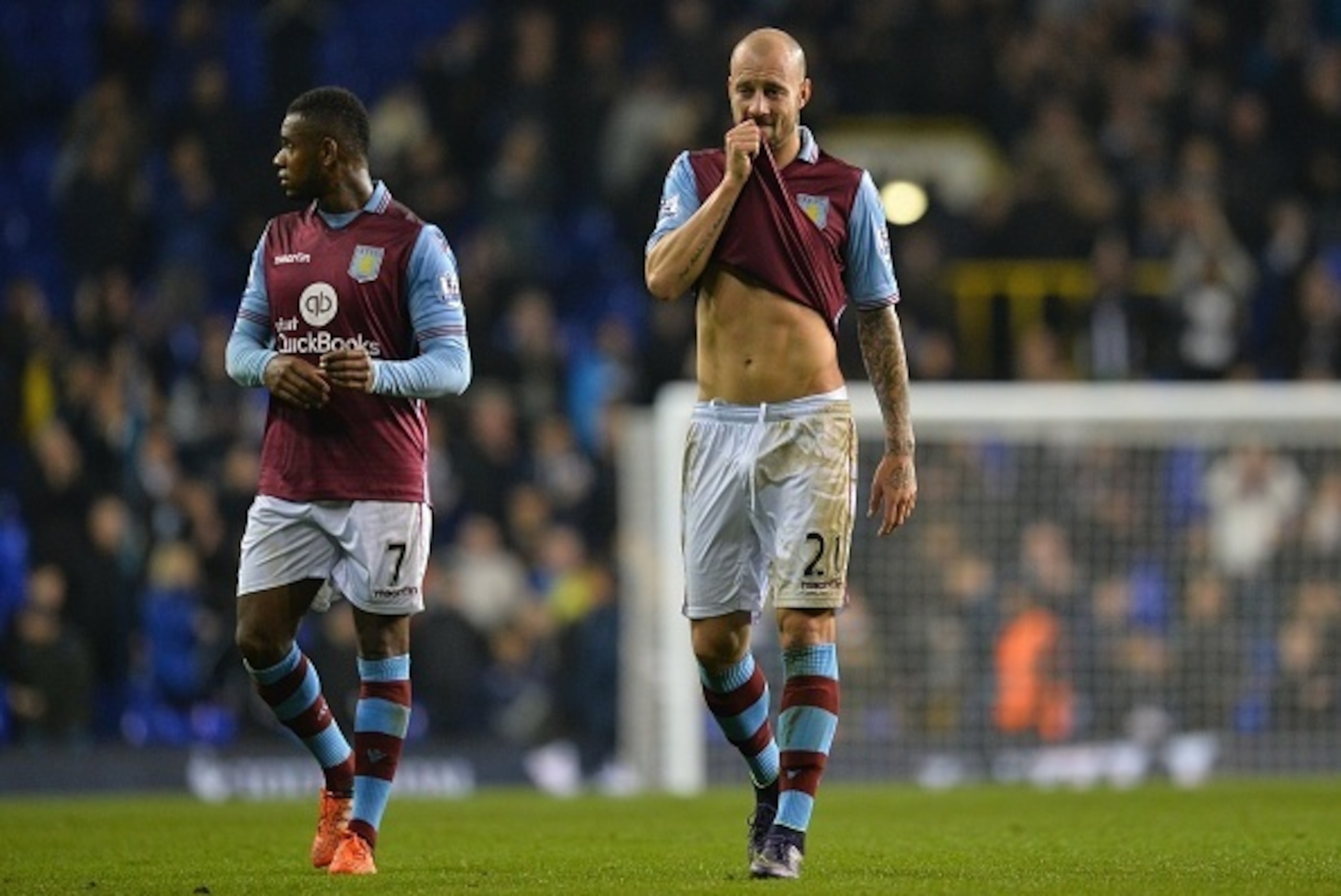 Aston Villa's Scottish defender Alan Hutton (R) reacts after losing the English Premier League football match between Tottenham Hotspur and Aston Villa at White Hart Lane in north London on November 2, 2015.  AFP PHOTO / GLYN KIRK
RESTRICTED TO EDITORIAL 