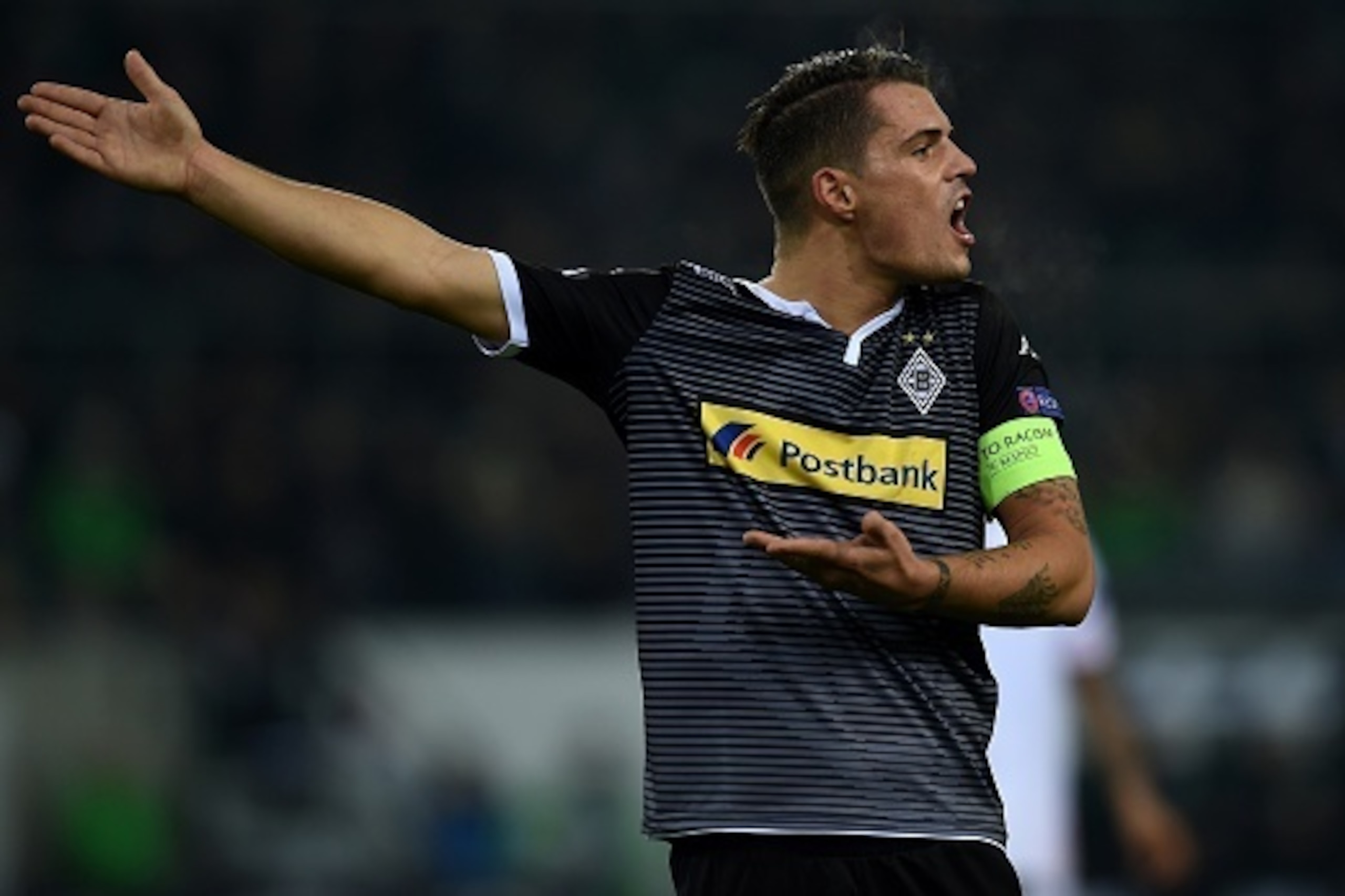 Moenchengladbach's Swiss midfielder Granit Xhaka reacts during the Group D, second-leg UEFA Champions League football match Borussia Moenchengladbach vs FC Sevilla in Moenchengladbach, western Germany on November 25, 2015.  / AFP / PATRIK STOLLARZ        