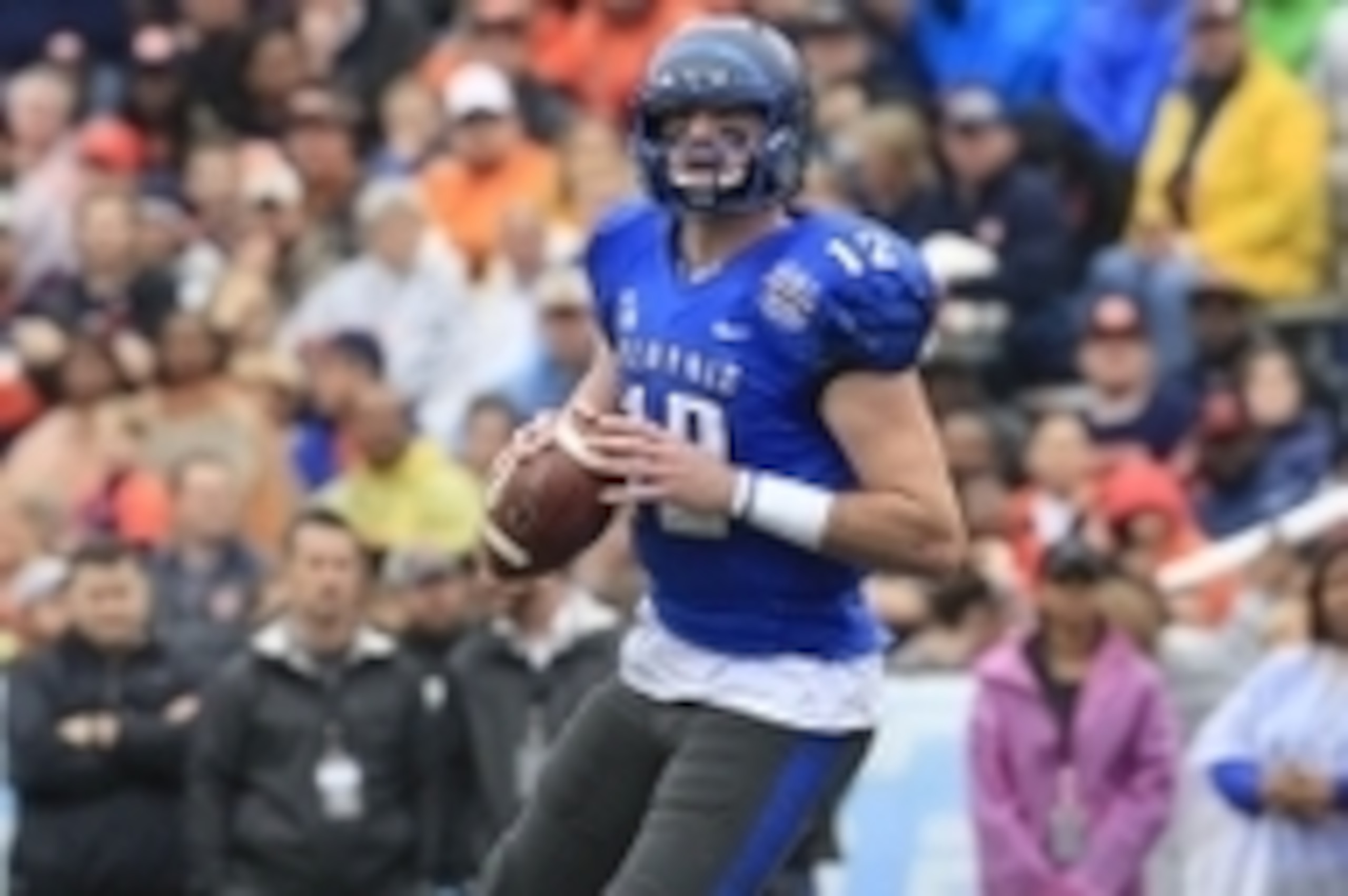Dec 30, 2015; Birmingham, AL, USA; Memphis Tigers quarterback Paxton Lynch (12) looks down field during the game against the Auburn Tigers in the 2015 Birmingham Bowl at Legion Field. Mandatory Credit: Marvin Gentry-USA TODAY Sports
