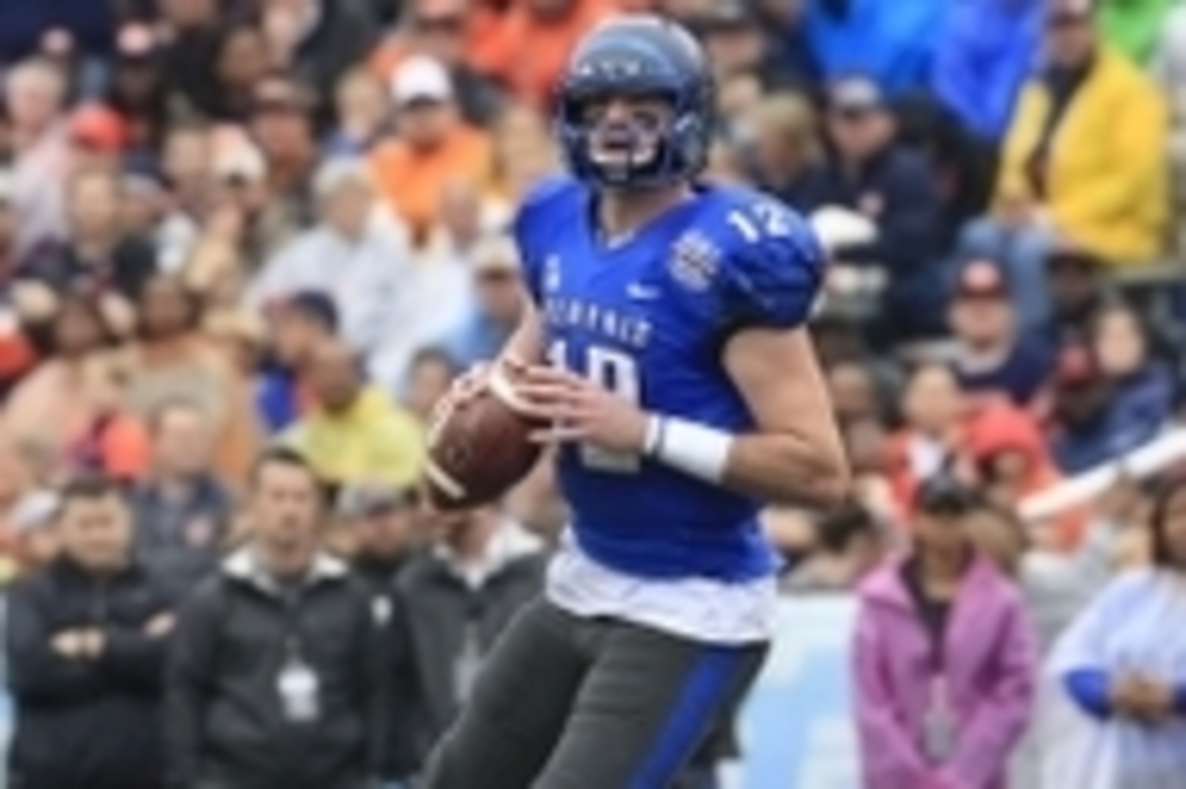 Dec 30, 2015; Birmingham, AL, USA; Memphis Tigers quarterback Paxton Lynch (12) looks down field during the game against the Auburn Tigers in the 2015 Birmingham Bowl at Legion Field. Mandatory Credit: Marvin Gentry-USA TODAY Sports