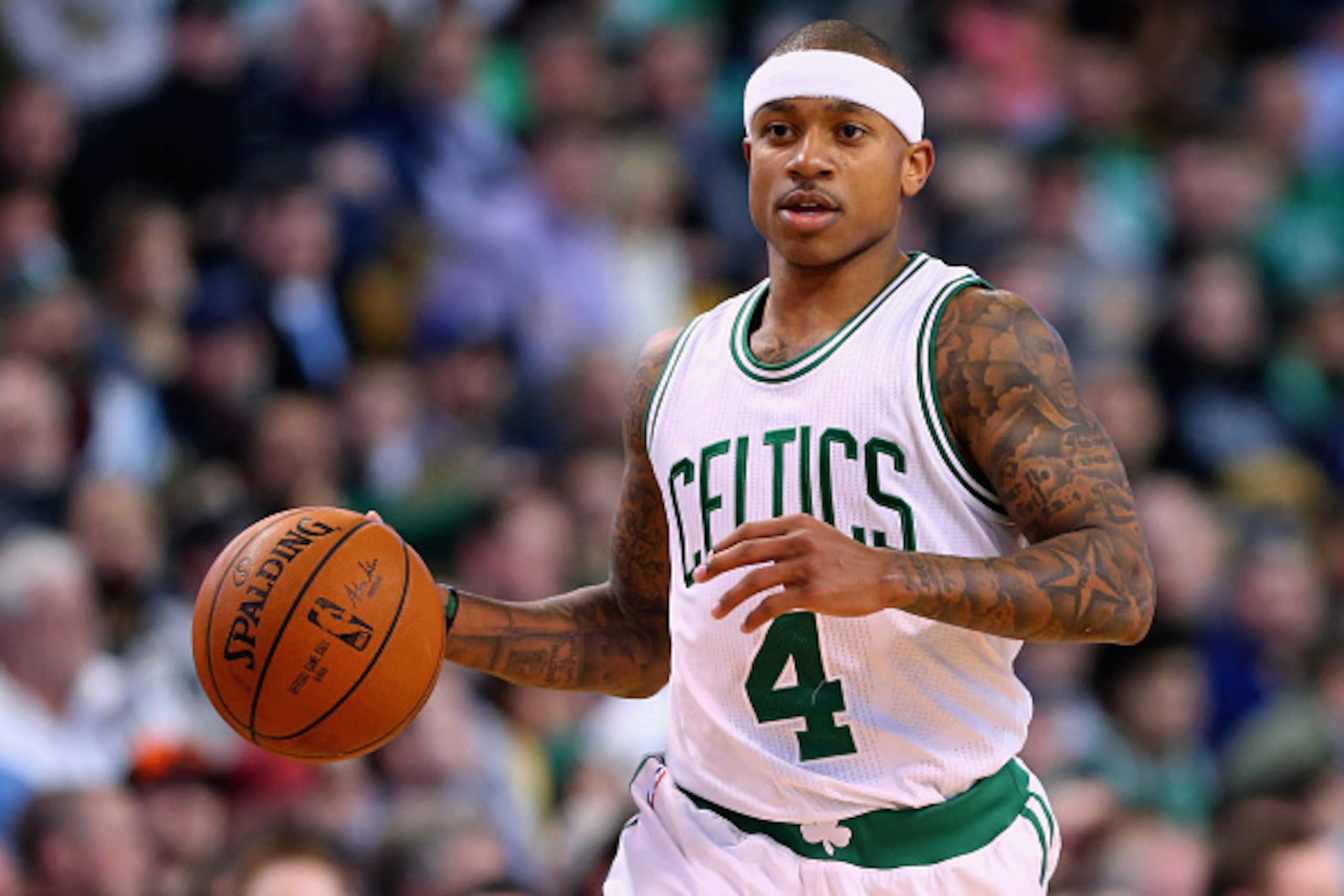 BOSTON, MA - JANUARY 27:  Isaiah Thomas #4 of the Boston Celtics carries the ball against the Denver Nuggets during the third quarter at TD Garden on January 27, 2016 in Boston, Massachusetts. NOTE TO USER: User expressly acknowledges and agrees that, by 