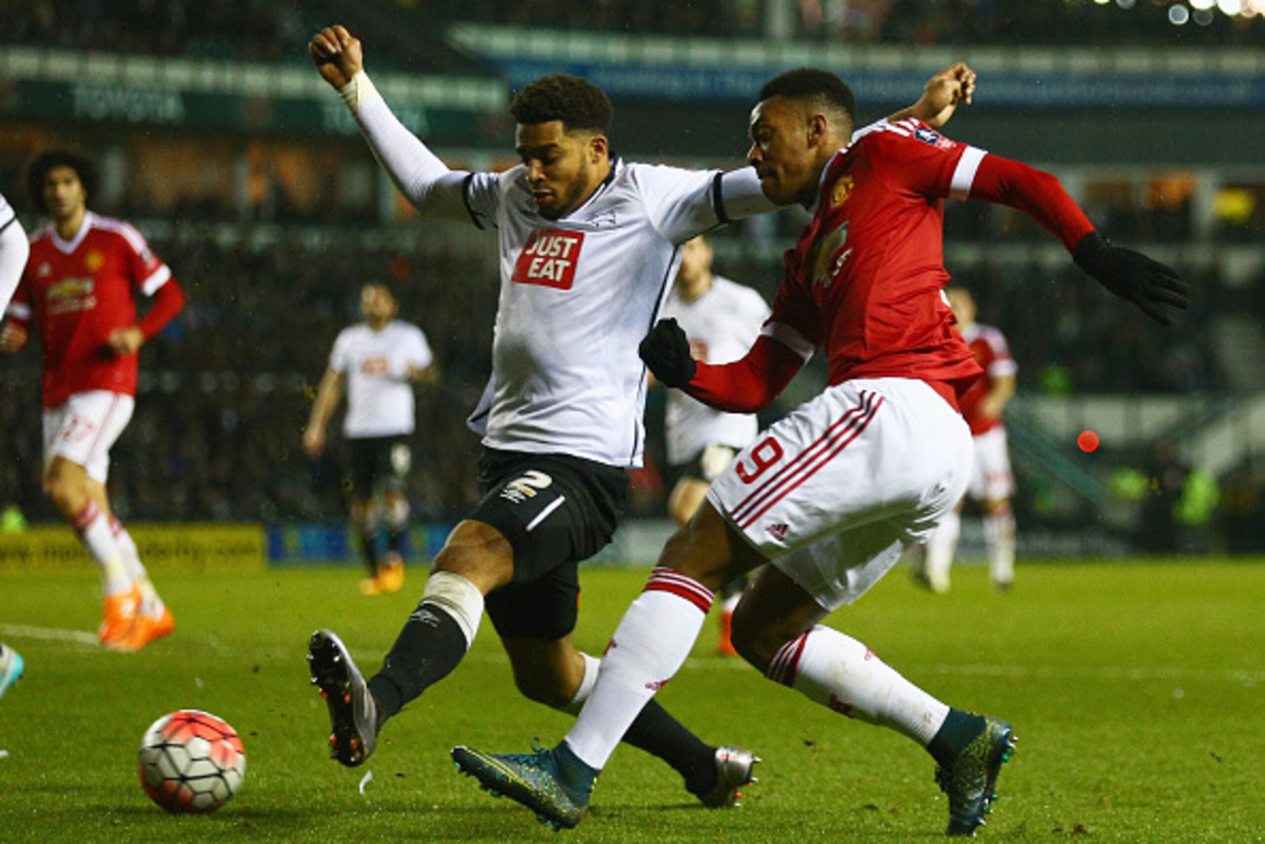 DERBY, ENGLAND - JANUARY 29: Anthony Martial of Manchester United beats Cyrus Christie of Derby County during the Emirates FA Cup fourth round match between Derby County and Manchester United at iPro Stadium on January 29, 2016 in Derby, England. (Photo DERBY, ENGLAND - JANUARY 29: Anthony Martial of Manchester United beats Cyrus Christie of Derby County during the Emirates FA Cup fourth round match between Derby County and Manchester United at iPro Stadium on January 29, 2016 in Derby, England. (Photo