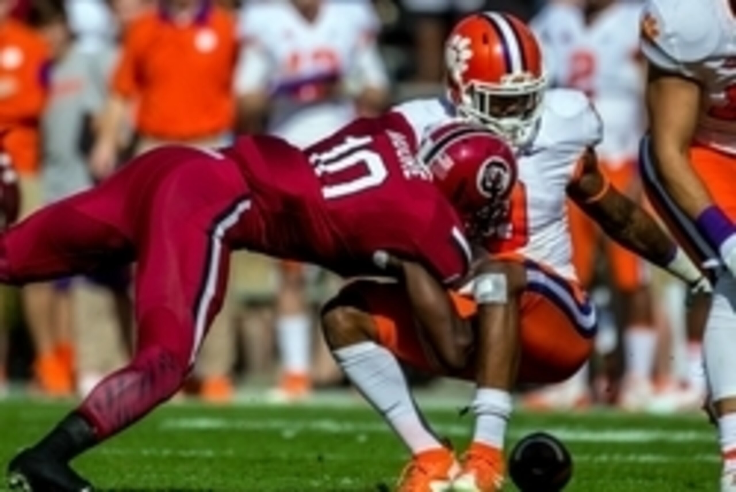 Nov 28, 2015; Columbia, SC, USA; Clemson Tigers running back Wayne Gallman (9) fumbles as he is hit by South Carolina Gamecocks linebacker Skai Moore (10) in the first half of the game at Williams-Brice Stadium. Mandatory Credit: Jeff Blake-USA TODAY Spor