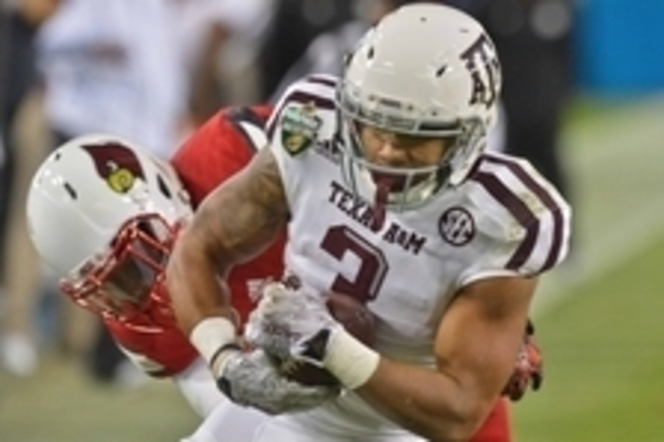 Dec 30, 2015; Nashville, TN, USA;Texas A&M Aggies wide receiver Christian Kirk (3) rushes for a touchdown against Louisville Cardinals safety Chucky Williams (22) during the second half of the 2015 Music City Bowl at Nissan Stadium. Louisville won 27-21. 