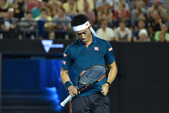 Japan's Kei Nishikori reacts during his men's singles match against Serbia's Novak Djokovic on day nine of the 2016 Australian Open tennis tournament in Melbourne on January 26, 2016. AFP PHOTO / SAEED KHAN---IMAGE RESTRICTED TO EDITORIAL USE - STRICTLY N