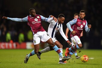 WEST BROMWICH, ENGLAND - JANUARY 23:  Saido Berahino of West Bromwich Albion and Aly Cissokho of Aston Villa during the Barclays Premier League match between West Bromwich Albion and Aston Villa at The Hawthorns on January 23, 2016 in West Bromwich, Engla