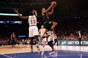 Jan 29, 2016; New York, NY, USA;  Phoenix Suns forward T.J. Warren (12) drives up past New York Knicks guard Jerian Grant (13) during the first quarter at Madison Square Garden. Mandatory Credit: Anthony Gruppuso-USA TODAY Sports
