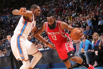 OKLAHOMA CITY, OK- JANUARY 29:  James Harden #13 of the Houston Rockets handles the ball against Kevin Durant #35 of the Oklahoma City Thunder on January 29, 2016 at Chesapeake Energy Arena in Oklahoma City, Oklahoma. NOTE TO USER: User expressly acknowle