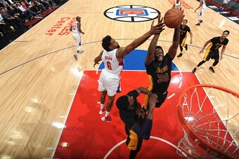 LOS ANGELES, CA - JANUARY 29:  Julius Randle #30 of the Los Angeles Lakers grabs the rebound against DeAndre Jordan #6 of the Los Angeles Clippers on January 29, 2016 at STAPLES Center in Los Angeles, California. NOTE TO USER: User expressly acknowledges 