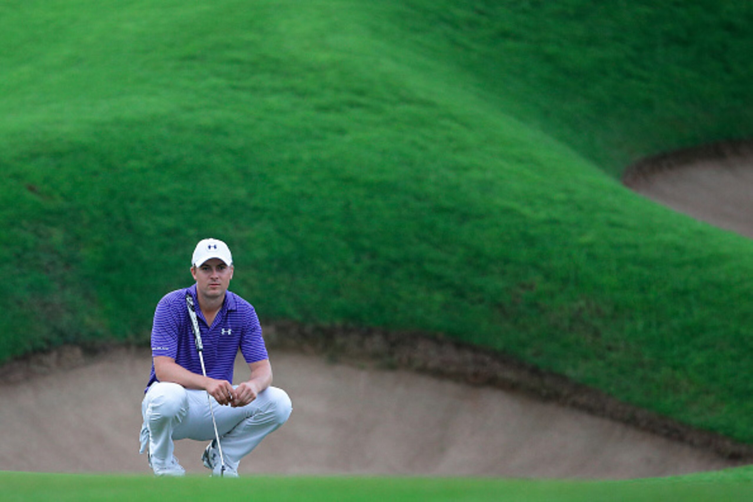 SINGAPORE - JANUARY 30:  Jordan Spieth of the United States waits to play his shot on the eight green during the completion of the inclement weather second round on day three of the SMBC Singapore Open at the Sentosa Golf Club Serapong course on January 3