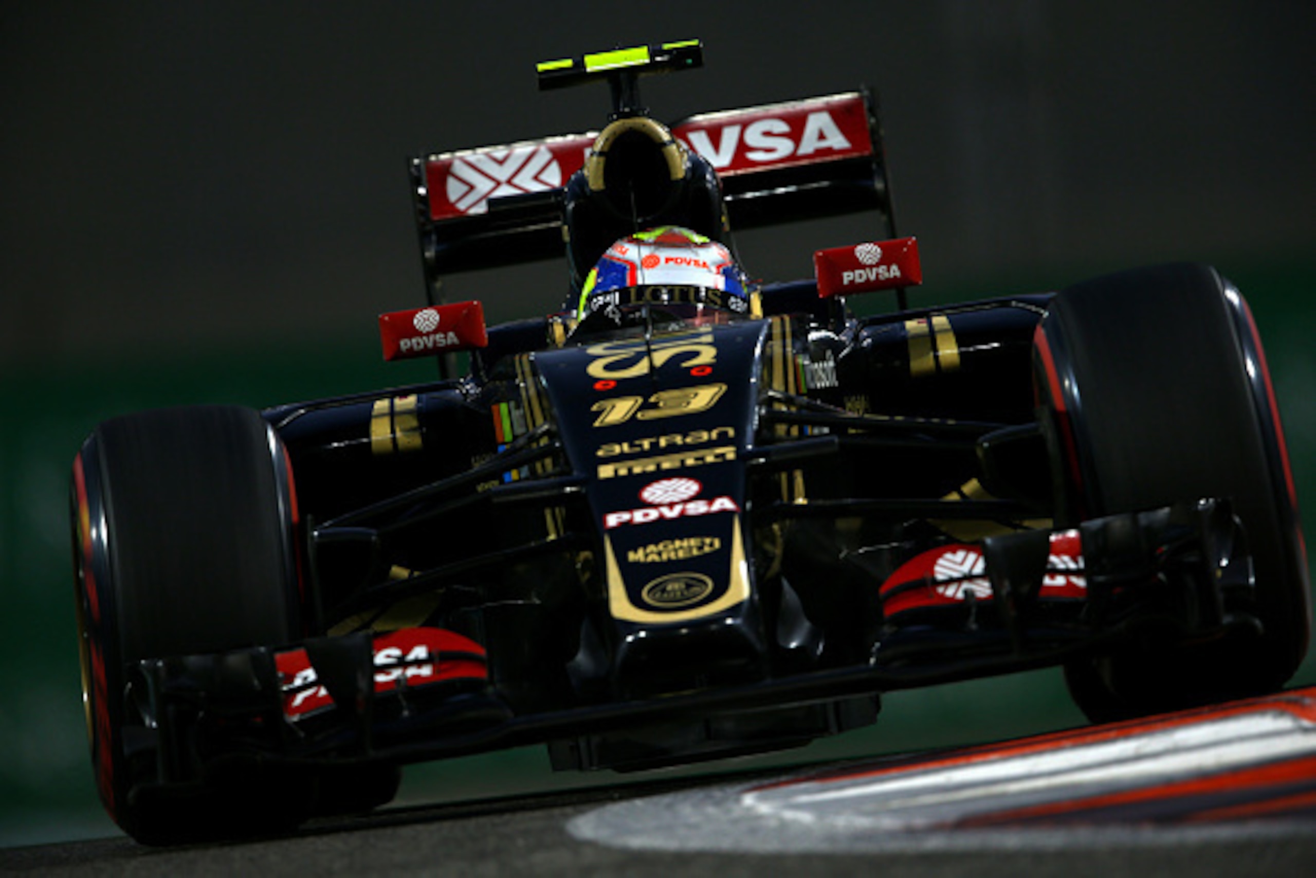 ABU DHABI, UNITED ARAB EMIRATES - NOVEMBER 28:  Pastor Maldonado of Venezuela and Lotus drives during qualifying for the Abu Dhabi Formula One Grand Prix at Yas Marina Circuit on November 28, 2015 in Abu Dhabi, United Arab Emirates.  (Photo by Paul Gilham