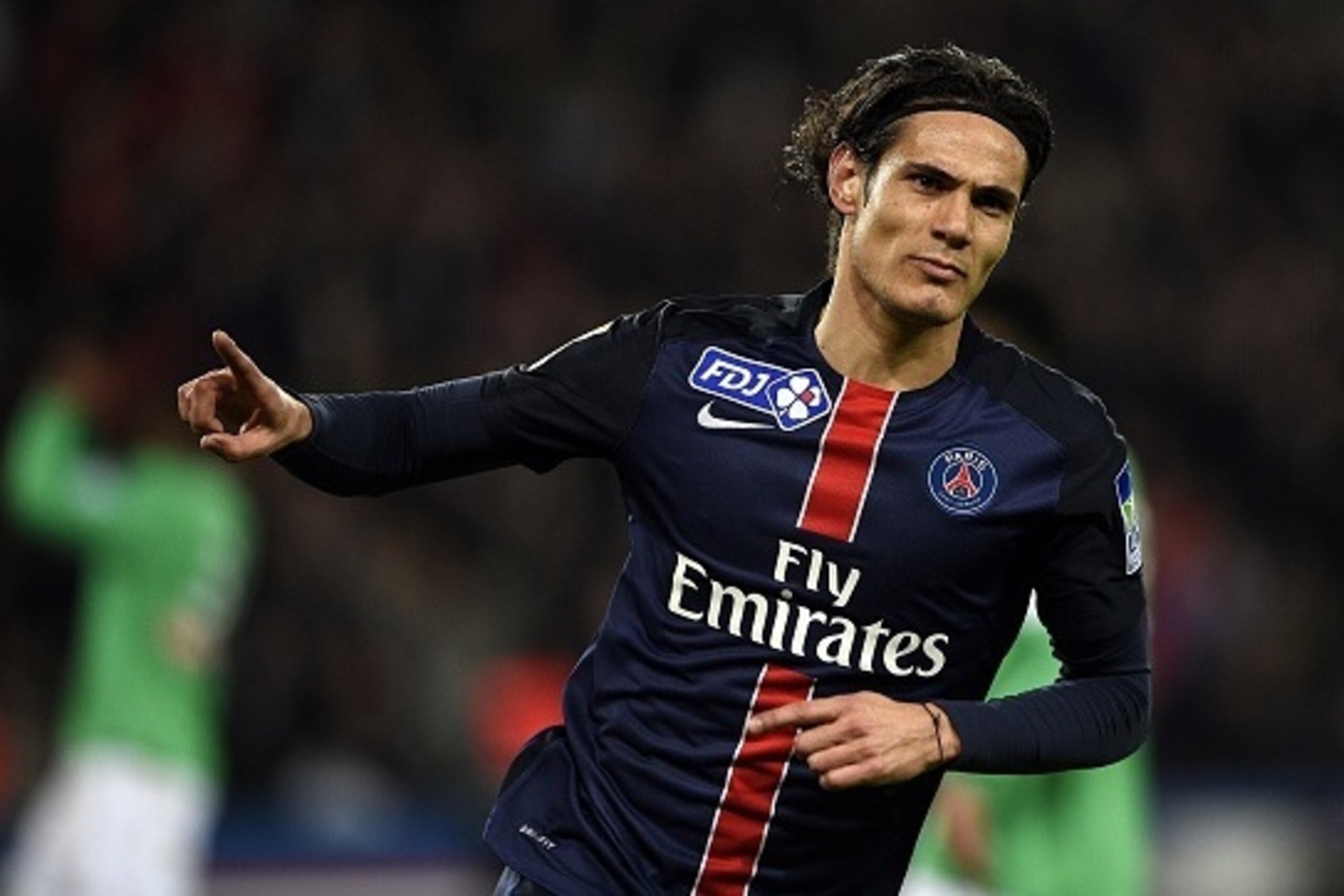 Paris Saint-Germain's Uruguyan forward Edinson Cavani celebrates after scoring a  goal during the French League Cup match between Paris Saint-Germain (PSG) and Saint-Etienne (ASSE) on December 15, 2015 at the Parc des Princes stadium in Paris. AFP PHOTO /