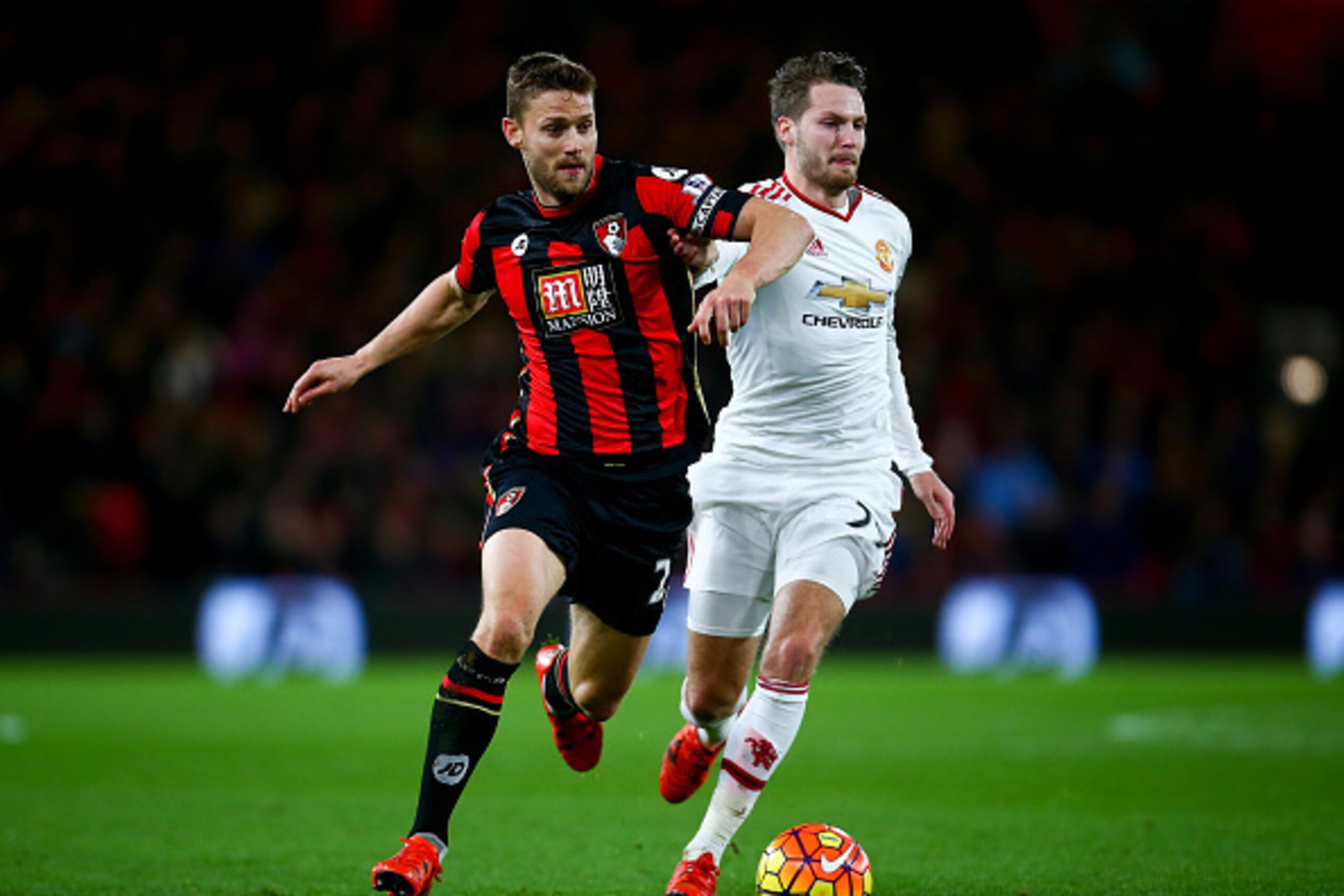 BOURNEMOUTH, ENGLAND - DECEMBER 12: Simon Francis of Bournemouth and Nick Powell of Manchester United compete for the ball during the Barclays Premier League match between A.F.C. Bournemouth and Manchester United at Vitality Stadium on December 12, 2015 BOURNEMOUTH, ENGLAND - DECEMBER 12: Simon Francis of Bournemouth and Nick Powell of Manchester United compete for the ball during the Barclays Premier League match between A.F.C. Bournemouth and Manchester United at Vitality Stadium on December 12, 2015