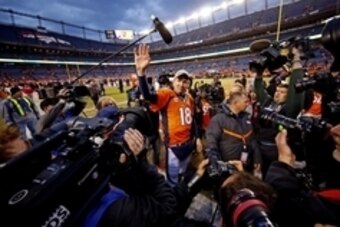 Jan 24, 2016; Denver, CO, USA; Denver Broncos quarterback Peyton Manning (18) waves to fans after the game against the New England Patriots in the AFC Championship football game at Sports Authority Field at Mile High. Mandatory Credit: Kevin Jairaj-USA TO