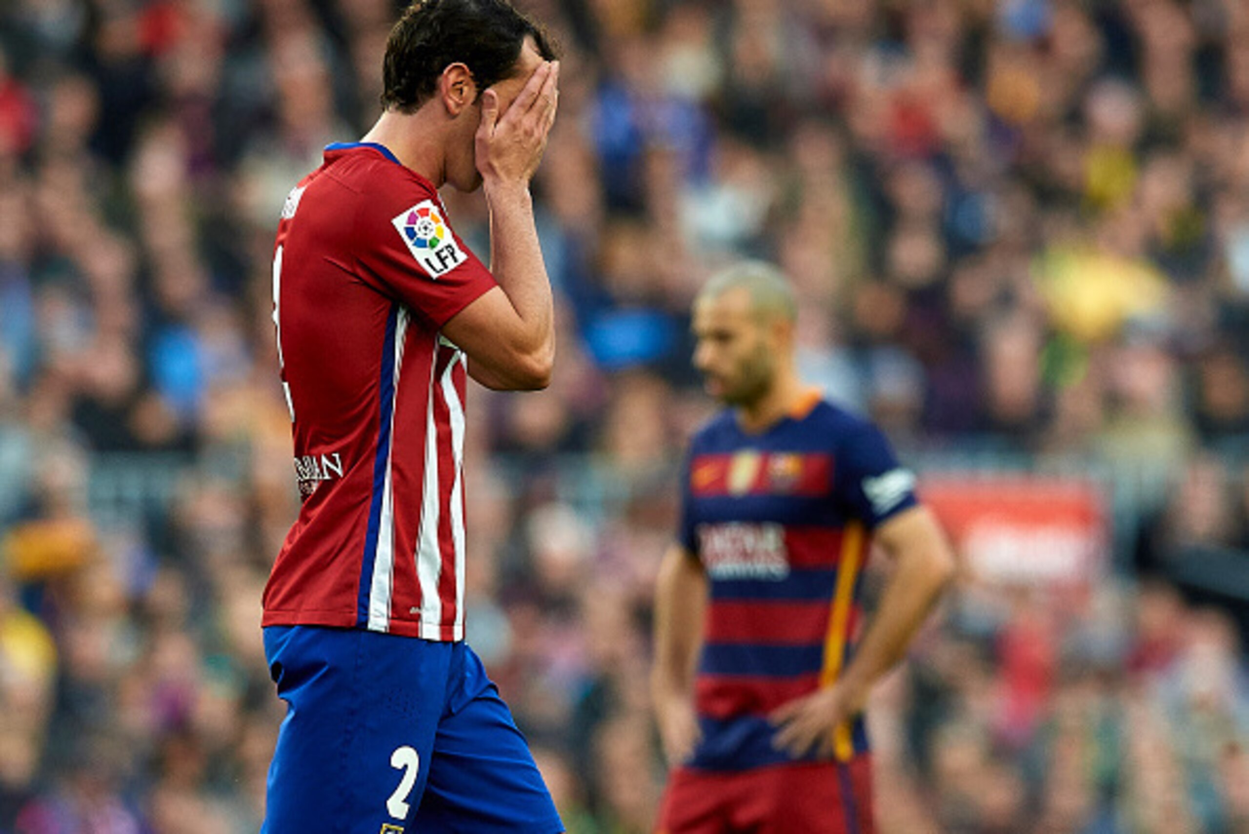 BARCELONA, SPAIN - JANUARY 30:  Godin of Atletico de Madrid leaves the field after receiving a red card during the La Liga match between FC Barcelona and Atletico de Madrid at Camp Nou on January 30, 2016 in Barcelona, Spain.  (Photo by Manuel Queimadelos