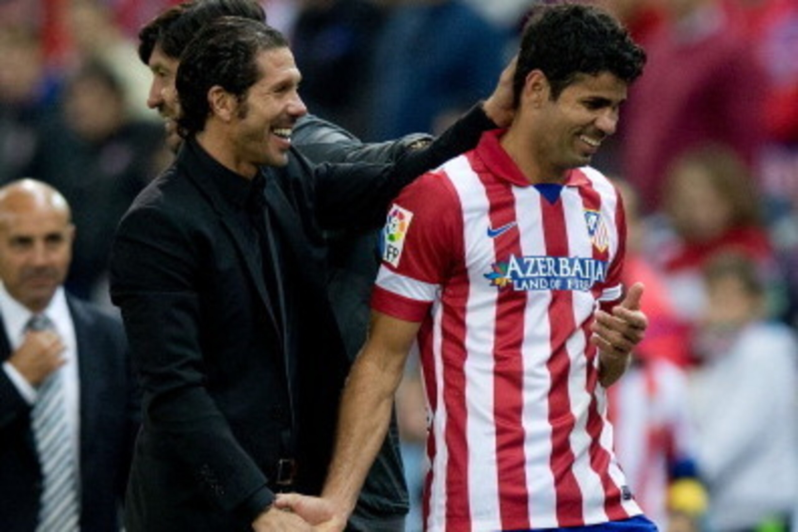 MADRID, SPAIN - OCTOBER 27: Head coach Diego Simeone of Atletico de Madrid congratulates goal-scorer Diego Costa during the La Liga match between Club Atletico de Madrid and Real Betis Balompieat at Vicente Calderon Stadium on October 27, 2013 in Madrid, 