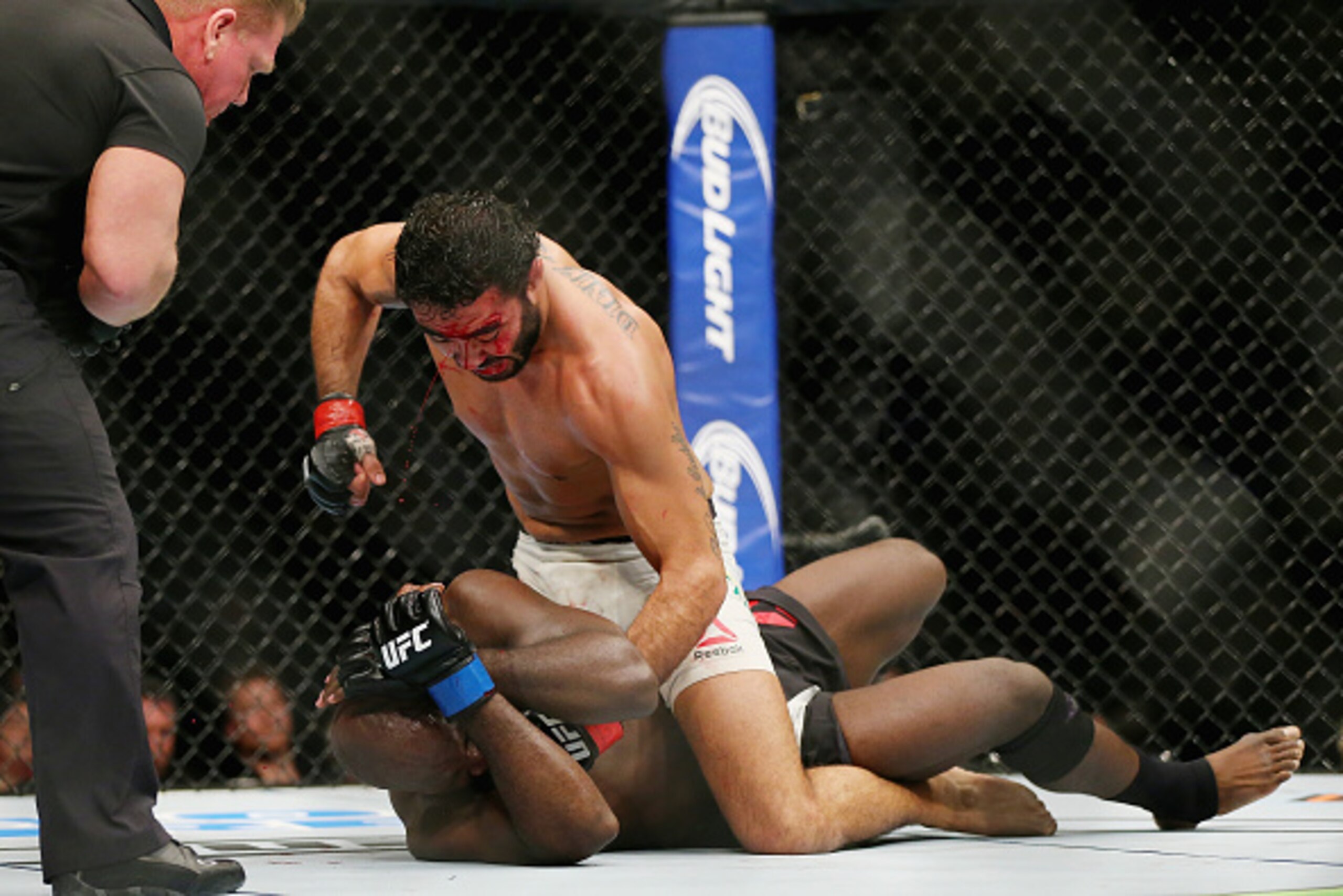 NEWARK, NJ - JANUARY 30:  Rafael Natal of Brazil punches Kevin Casey of the United States in their middleweight bout during the UFC Fight Night event at the Prudential Center on January 30, 2016 in Newark, New Jersey. Natal won by TKO.  (Photo by Elsa/Get