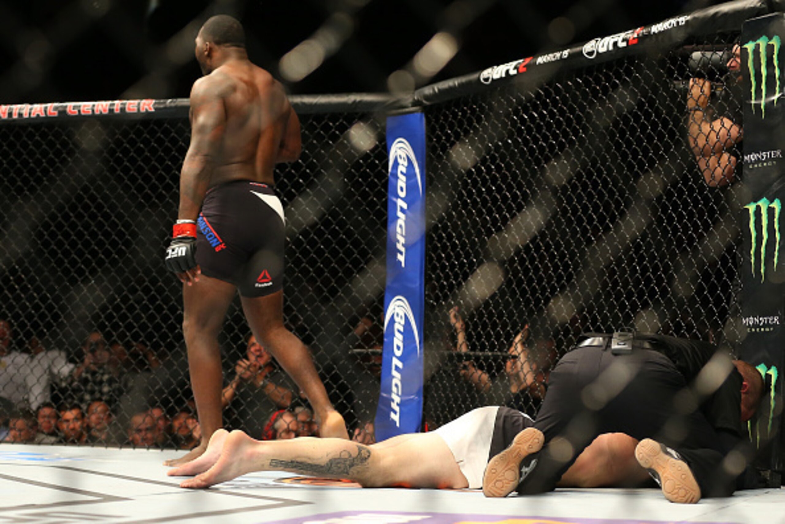 NEWARK, NJ - JANUARY 30:  (L-R) Anthony Johnson celebrates his knockout victory over Ryan Bader in their light heavyweight bout during the UFC Fight Night event at the Prudential Center on January 30, 2016 in Newark, New Jersey. (Photo by Ed Mulholland/Zu