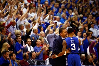 LAWRENCE, KS - JANUARY 30:  Head coach John Calipari of the Kentucky Wildcats talks with Tyler Ulis #3 during the final minutes of overtime in the game against the Kansas Jayhawks at Allen Fieldhouse on January 30, 2016 in Lawrence, Kansas.  (Photo by Jam