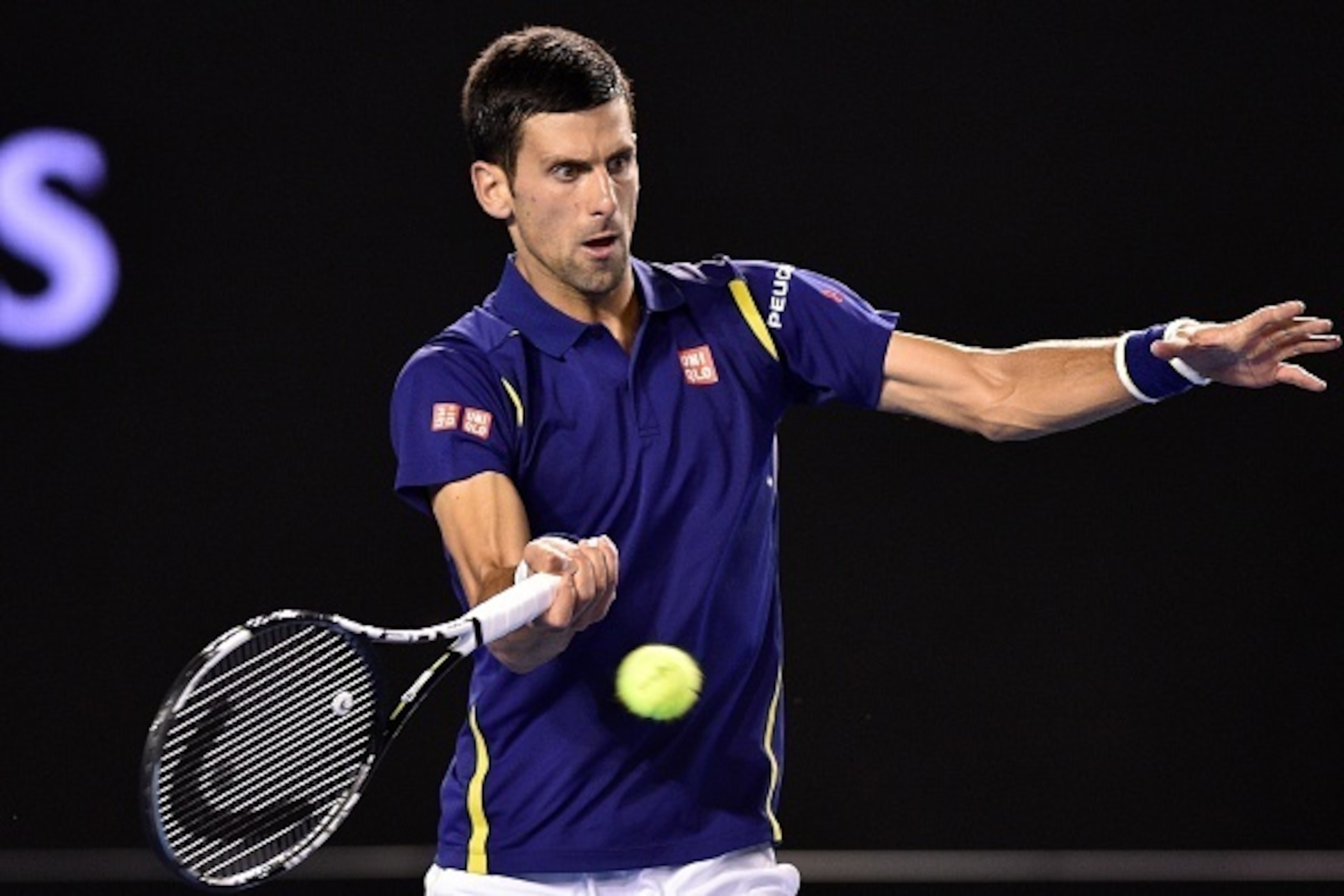 Serbia's Novak Djokovic hits a return during the men's singles final against Britain's Andy Murray on day 14 of the 2016 Australian Open tennis tournament in Melbourne on January 31, 2016. AFP PHOTO / PETER PARKS -- IMAGE RESTRICTED TO EDITORIAL USE - STR
