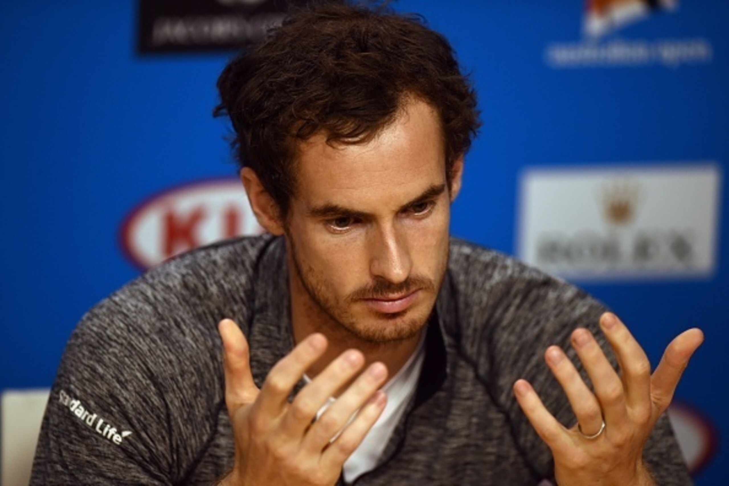Andy Murray of Britain gestures at a press conference following his loss to Novak Djokovic of Serbia in their men's singles final match on day 14 of the 2016 Australian Open tennis tournament in Melbourne on January 31, 2016.     AFP PHOTO / GREG WOOD
-- 