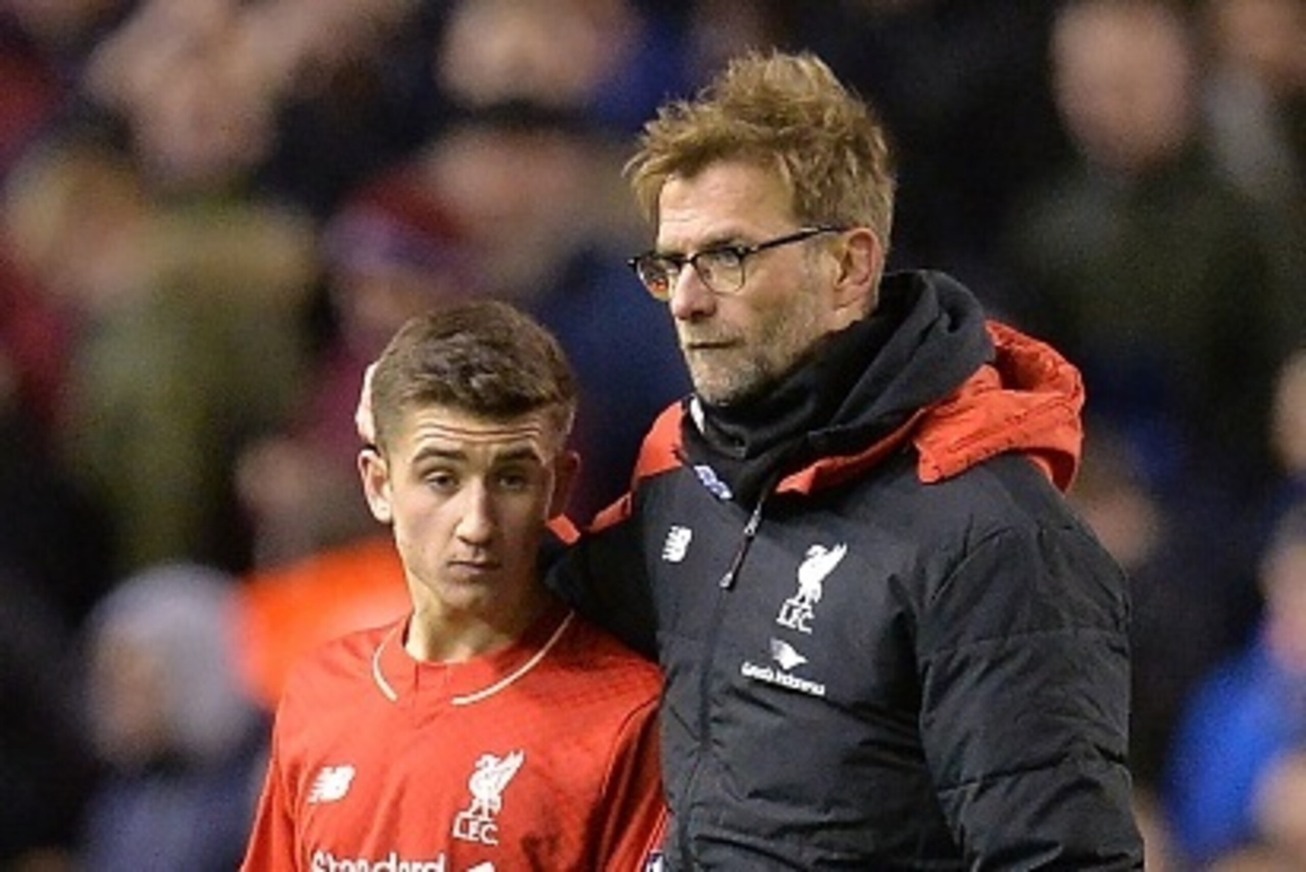 Liverpool's German manager Jurgen Klopp (R) speaks with Liverpool's English midfielder Cameron Brannagan after the end of the English FA Cup fourth round football match between Liverpool and West Ham United at Anfield in Liverpool, north west England, on 