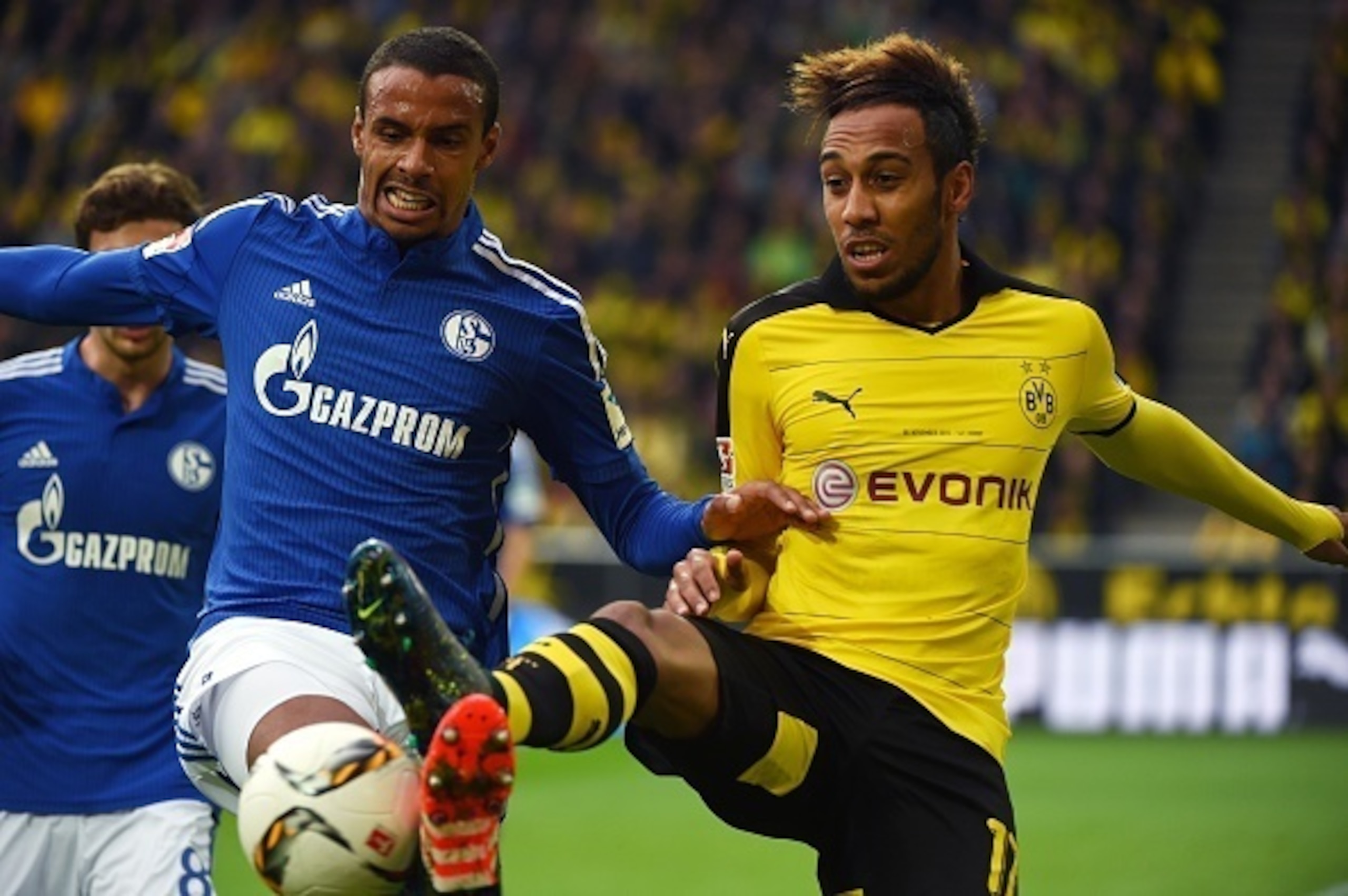 Dortmund's Gabonese striker Pierre-Emerick Aubameyang (R) and Schalke's Cameroonian defender Joel Matip vie for the ball during the German first division football Bundesliga match Borussia Dortmund vs FC Schalke 04 on November 8, 2015, 2015 in Dortmund, w
