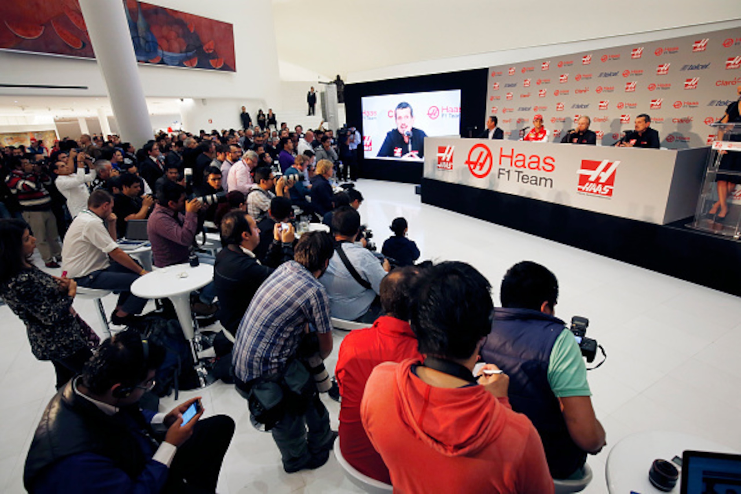 MEXICO CITY, MEXICO - OCTOBER 30:  A general view of the press conference with  (L-R) Carlos Slim Jr, Team Sponsor, Esteban Gutierrez, Gene Haas, founder and chairman and Guenther Steiner of Haas F1 Team during their driver announcement on October 30, 201