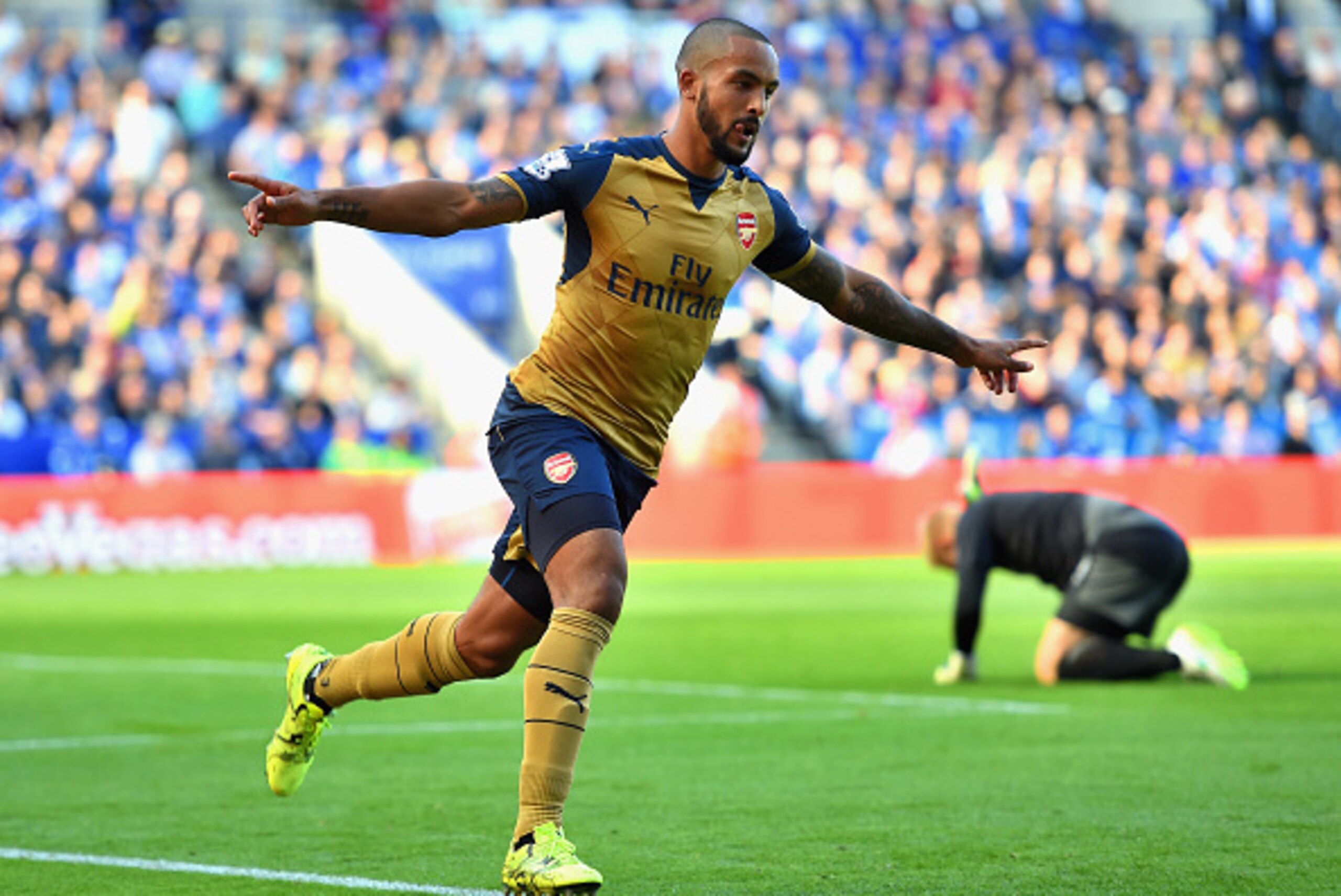 LEICESTER, ENGLAND - SEPTEMBER 26: Theo Walcott of Arsenal celebrates scoring his team's first goal during the Barclays Premier League match between Leicester City and Arsenal at The King Power Stadium on September 26, 2015 in Leicester, United Kingdom.  