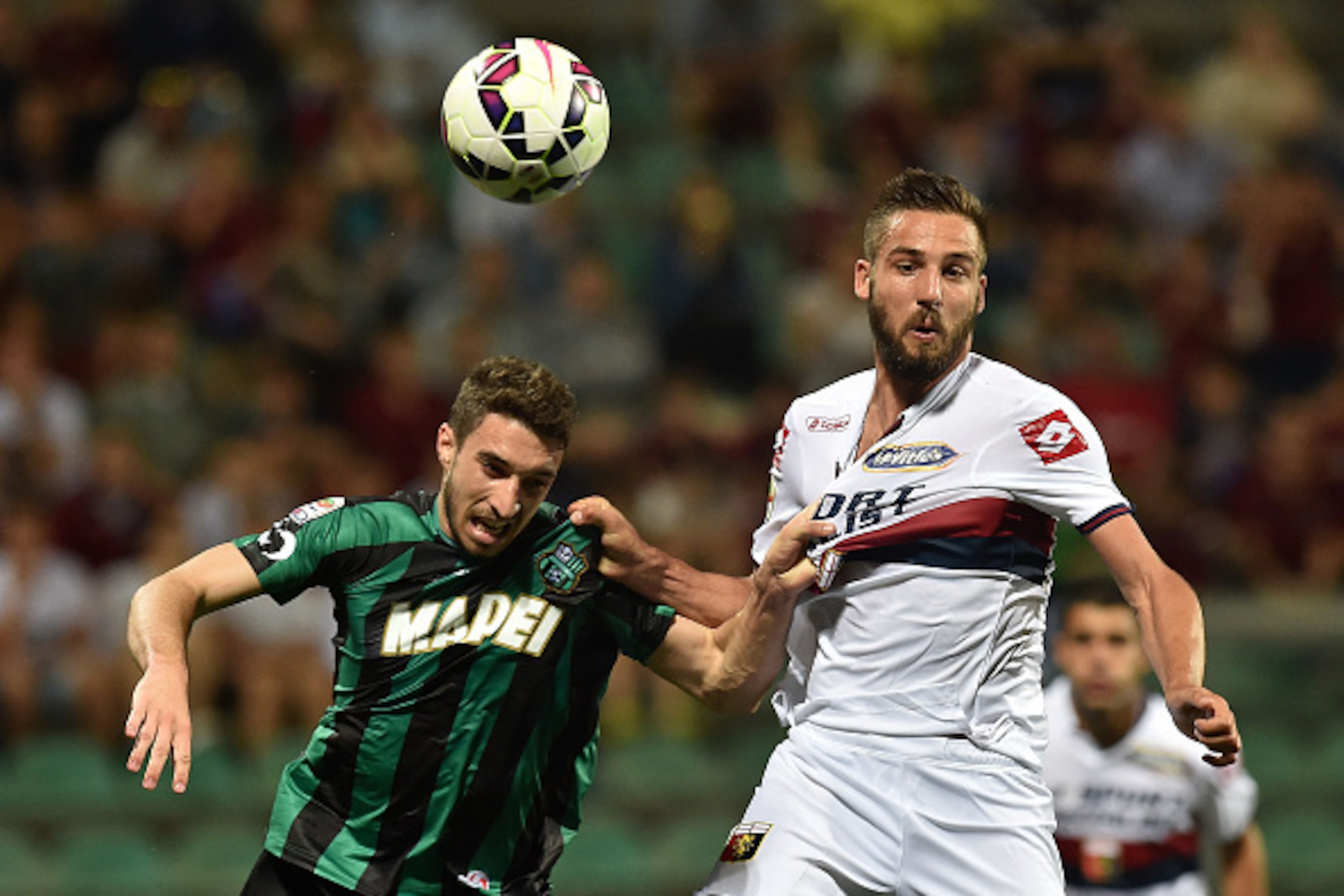 REGGIO NELL'EMILIA, ITALY - MAY 31: Sime Vrsaljko of Sassuolo and Leonardo Pavoletti of Genoa in action during the Serie A match between US Sassuolo Calcio and Genoa CFC at Mapei Stadium on May 31, 2015 in Reggio nell'Emilia, Italy. (Photo by Giuseppe Be REGGIO NELL'EMILIA, ITALY - MAY 31: Sime Vrsaljko of Sassuolo and Leonardo Pavoletti of Genoa in action during the Serie A match between US Sassuolo Calcio and Genoa CFC at Mapei Stadium on May 31, 2015 in Reggio nell'Emilia, Italy. (Photo by Giuseppe Be