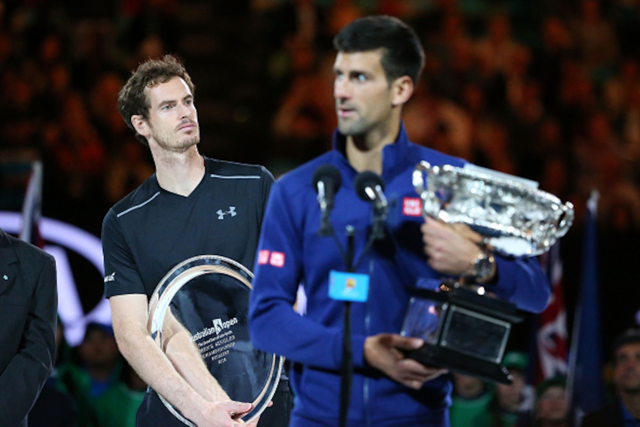 MELBOURNE, AUSTRALIA - JANUARY 31:  Australian Open champion Novak Djokovic of Serbia holds the Norman Brookes Challenge Cup as Andy Murray of Great Britain looks on after the Men's Singles Final during day 14 of the 2016 Australian Open at Melbourne Park