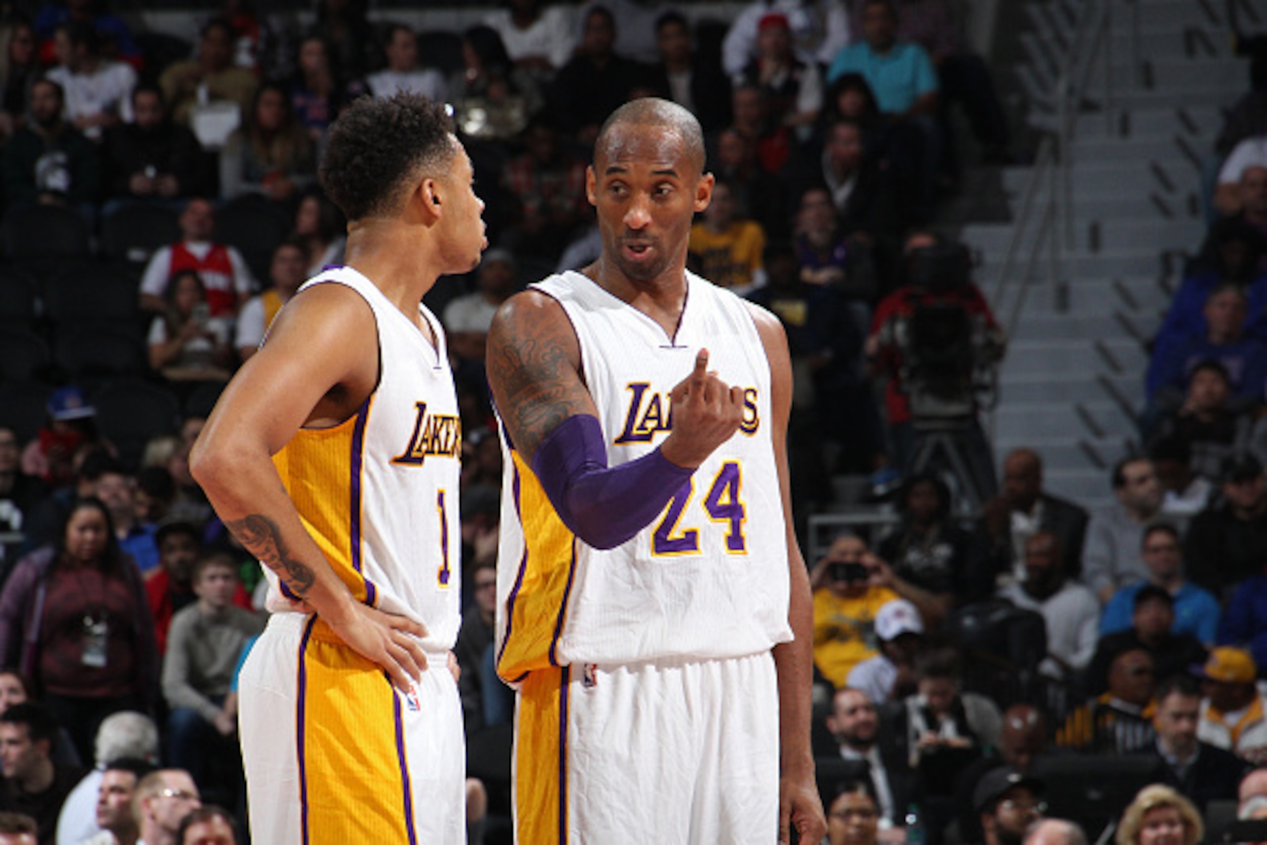 AUBURN HILLS, MI - DECEMBER 6:  Kobe Bryant #24 and D'Angelo Russell #1 of the Los Angeles Lakers talk during the game against the Detroit Pistons on December 6, 2015 at The Palace of Auburn Hills in Auburn Hills, Michigan. NOTE TO USER: User expressly ac