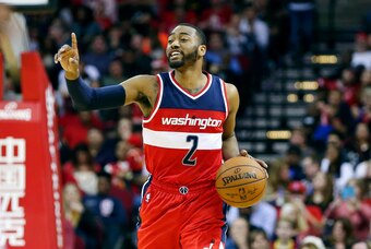 Jan 30, 2016; Houston, TX, USA; Washington Wizards guard John Wall (2) brings the ball up the court during the fourth quarter against the Houston Rockets at Toyota Center. The Wizards won 123-122. Mandatory Credit: Troy Taormina-USA TODAY Sports