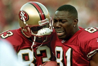 SAN FRANCISCO, UNITED STATES:  Teammate JJ. Stokes (L) comforts San Francisco 49ers wide receiver Terrell Owens (R) as he cries after catching the game-winning touchdown pass in the final seconds of their 03 January NFC Wild Card playoff game with the Gre