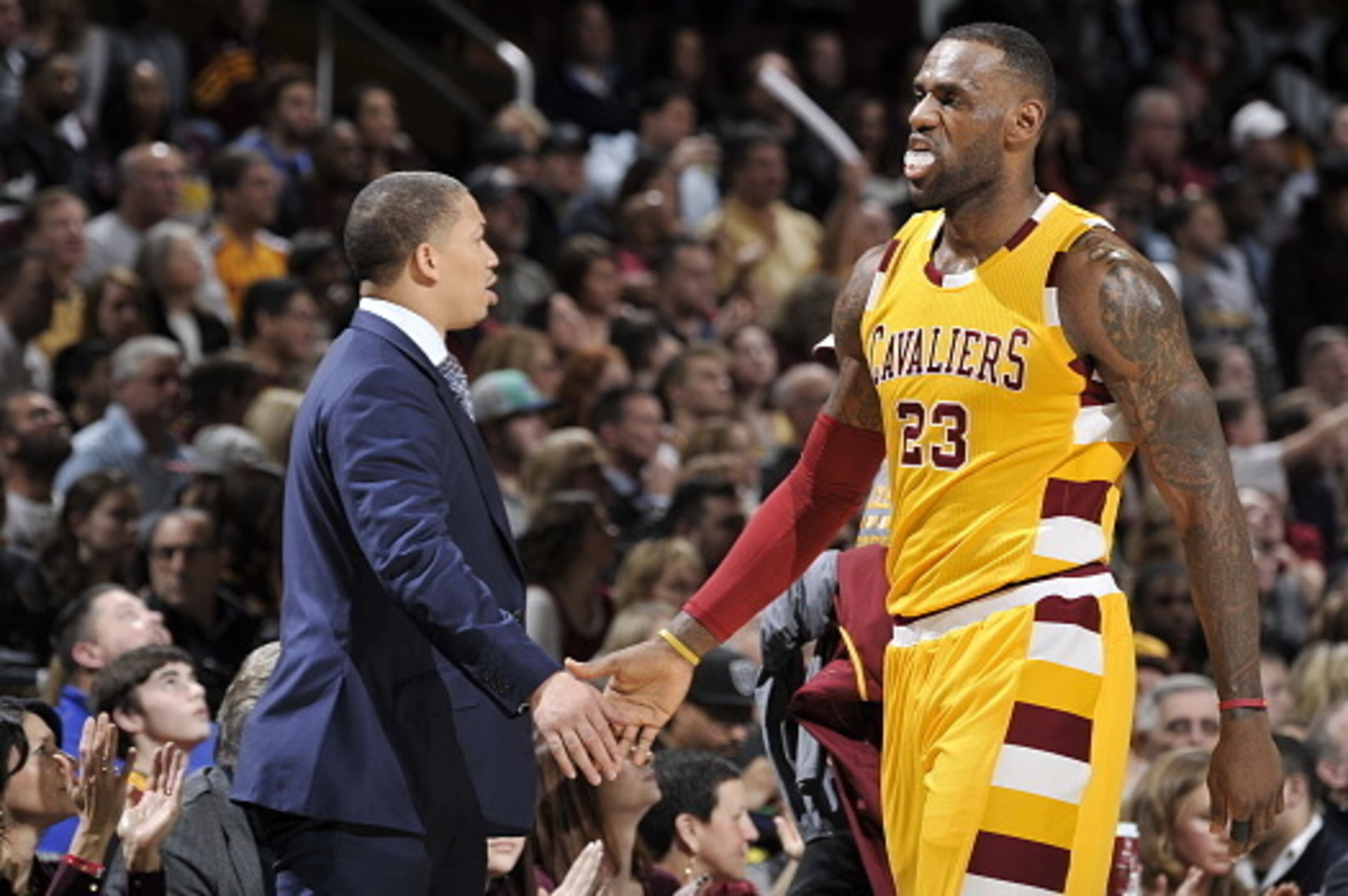 CLEVELAND, OH - JANUARY 30:  LeBron James #23 of the Cleveland Cavaliers high fives Head Coach Tyronn Lue during the game against the San Antonio Spurs on January 30, 2016 at Quicken Loans Arena in Cleveland, Ohio. NOTE TO USER: User expressly acknowledge
