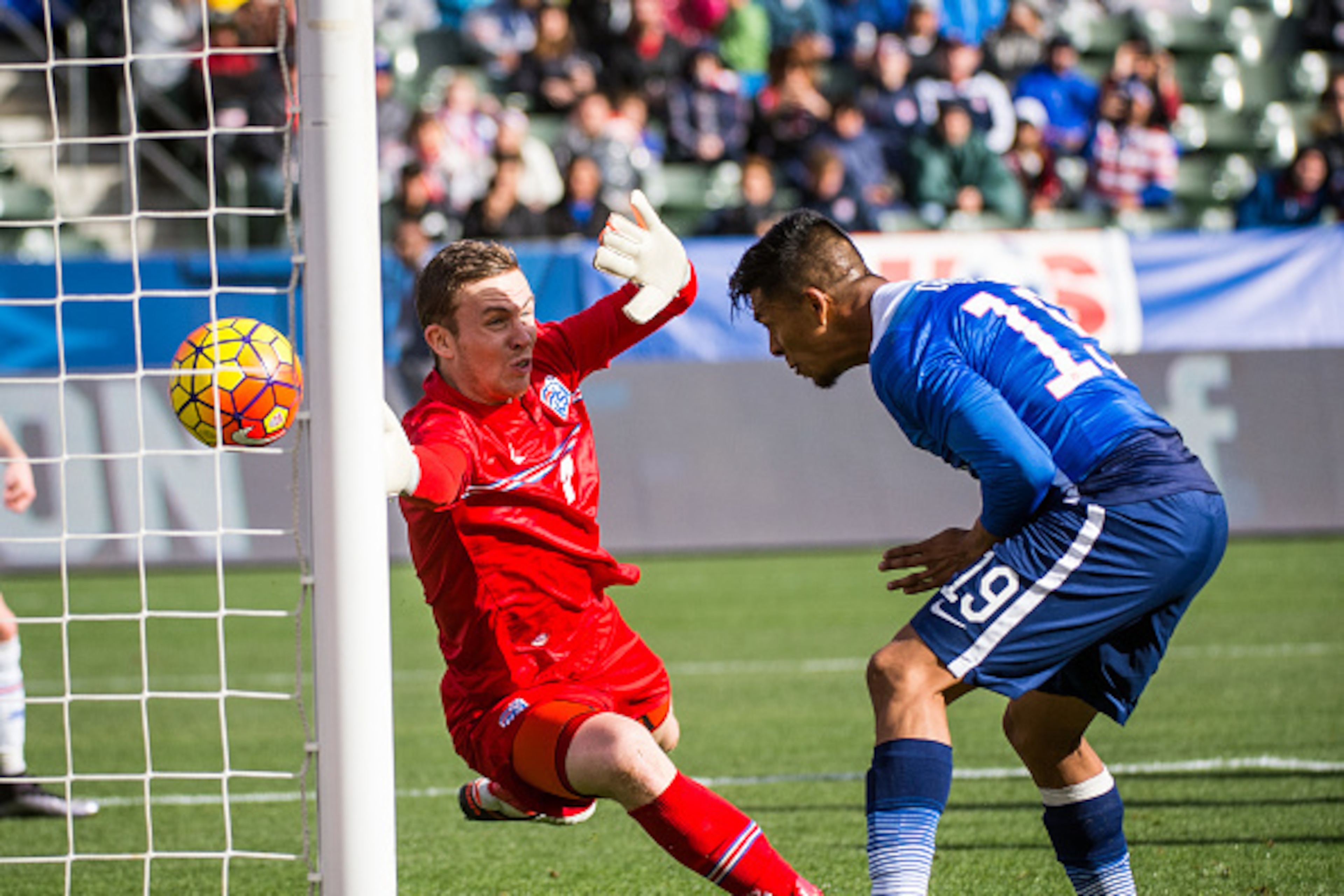 CARSON, CA - JANUARY 31: Michael Orozco #19 of the United States heads home a goal as Ogmundur Kristinsson #1 of Iceland attempts to block it during the International Soccer Friendly match between the United States and Iceland at the StubHub Center on Jan