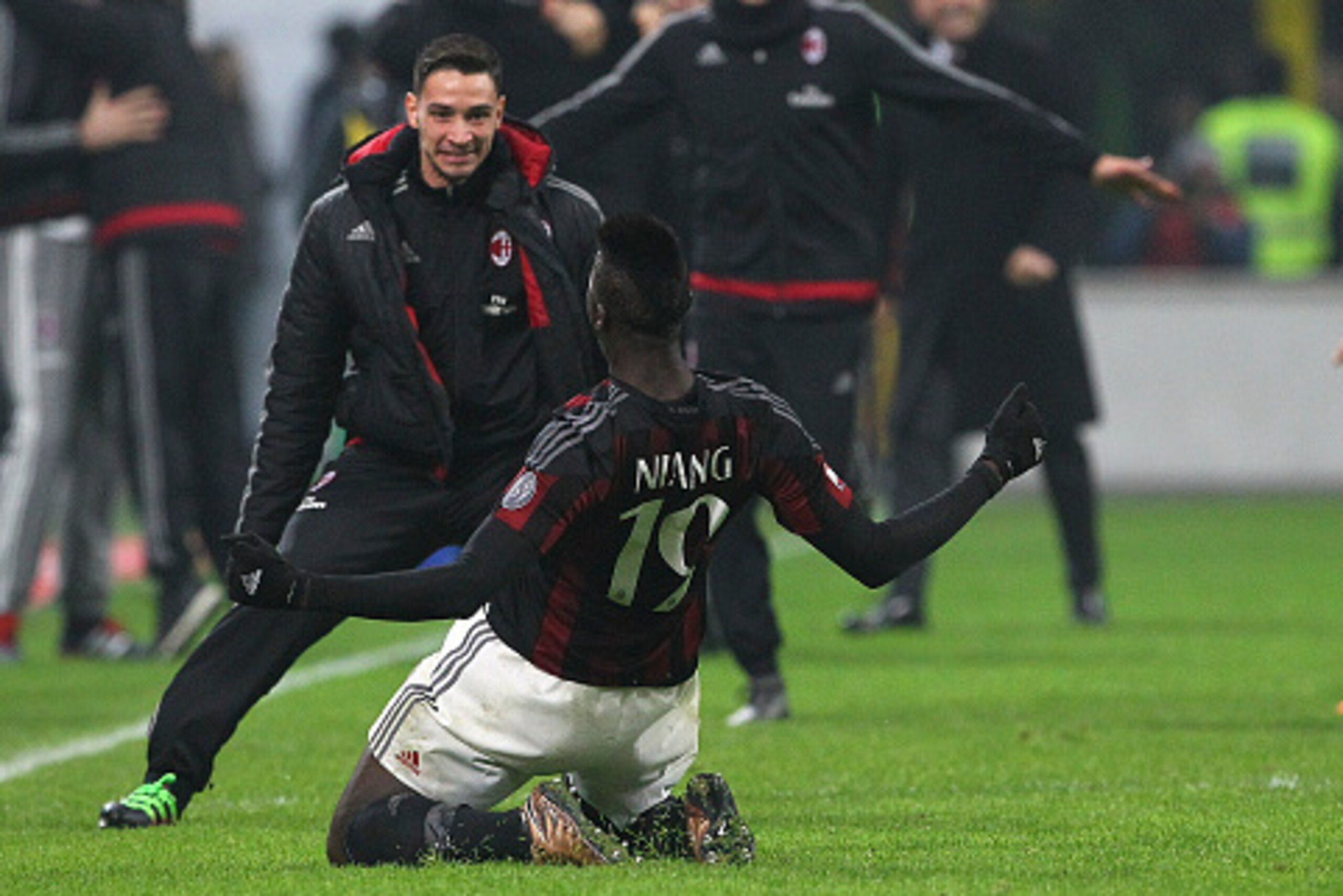 MILAN, ITALY - JANUARY 31:  M Baye Niang #19 of AC Milan celebrates his goal with his team-mate Mattia De Sciglio (L) during the Serie A match between AC Milan and FC Internazionale Milano at Stadio Giuseppe Meazza on January 31, 2016 in Milan, Italy.  (P