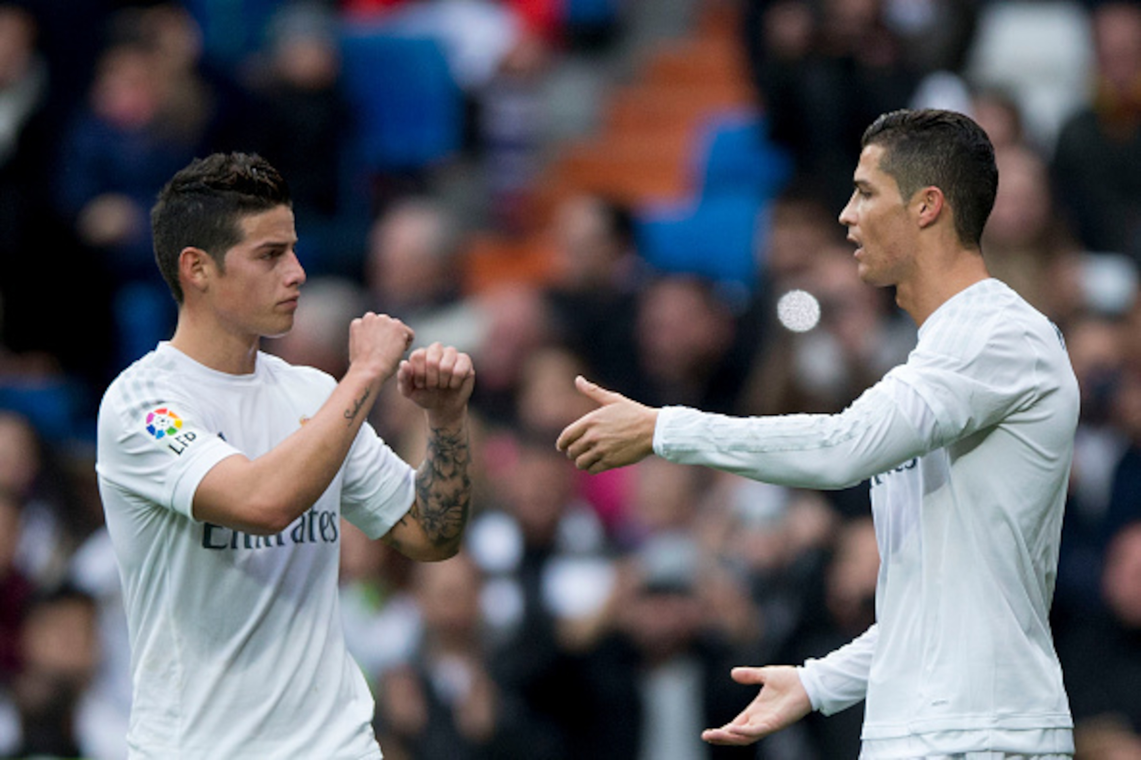 MADRID, SPAIN - DECEMBER 30: Cristiano Ronaldo (R) of Real Madrid CF celebrates scoring their opening goal with teammate James Rodriguez (L) during the La Liga match between Real Madrid CF and Real Sociedad de Futbol at Estadio Santiago Bernabeu on Decem MADRID, SPAIN - DECEMBER 30: Cristiano Ronaldo (R) of Real Madrid CF celebrates scoring their opening goal with teammate James Rodriguez (L) during the La Liga match between Real Madrid CF and Real Sociedad de Futbol at Estadio Santiago Bernabeu on Decem