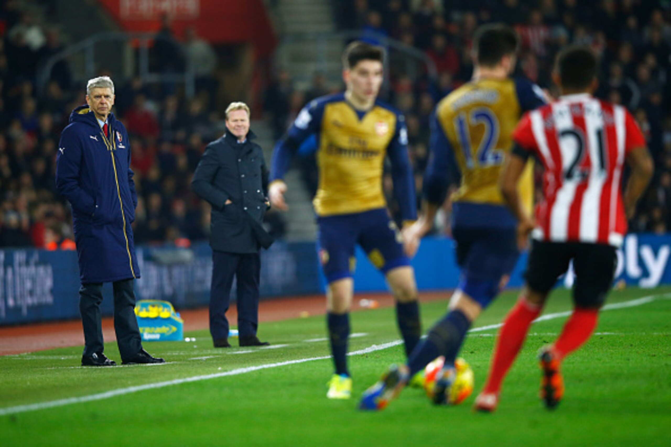 SOUTHAMPTON, ENGLAND - DECEMBER 26:  Arsene Wenger manager of Arsenal and Ronald Koeman manager of Southampton watch the action during the Barclays Premier League match between Southampton and Arsenal at St Mary's Stadium on December 26, 2015 in Southampt