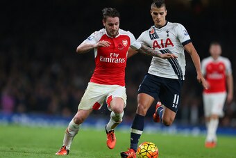LONDON, ENGLAND - NOVEMBER 08:  Mathieu Debuchy of Arsenal and Erik Lamela of Tottenham Hotspur during the Barclays Premier League match between Arsenal and Tottenham Hotspur at Emirates Stadium on November 8, 2015 in London, England.  (Photo by Catherine