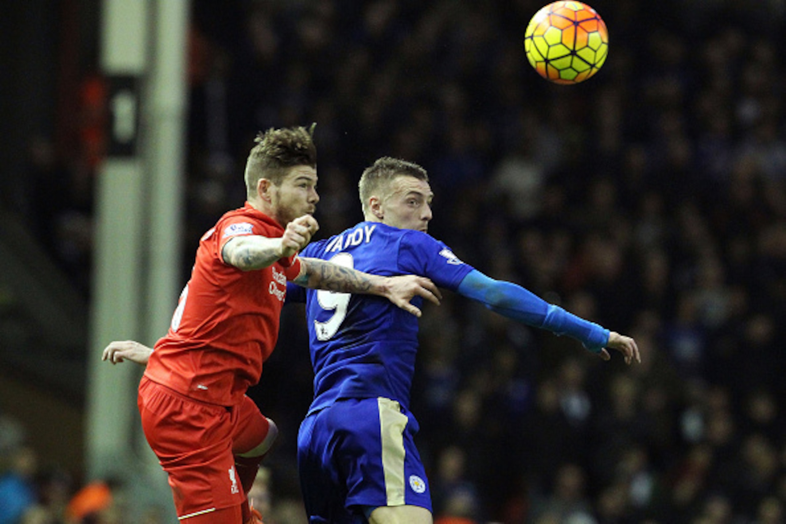 Liverpool's Spanish defender Alberto Moreno (L) vies with Leicester City's English striker Jamie Vardy during the English Premier League football match between Liverpool and Leicester City at the Anfield stadium in Liverpool, north-west England on Decembe