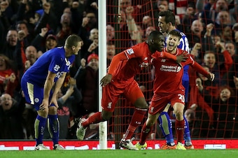 LIVERPOOL, ENGLAND - DECEMBER 26:  Christian Benteke of Liverpool celebrates scoring his side's first goal during the Barclays Premier League match between Liverpool and Leicester City at Anfield on December 26, 2015 in Liverpool, England.  (Photo by Chri