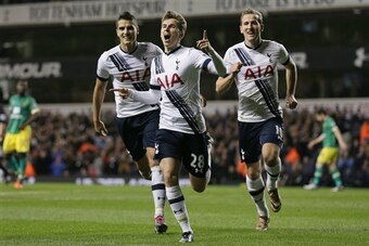 Tom Carroll celebrates sealing Tottenham's win over Norwich in December.