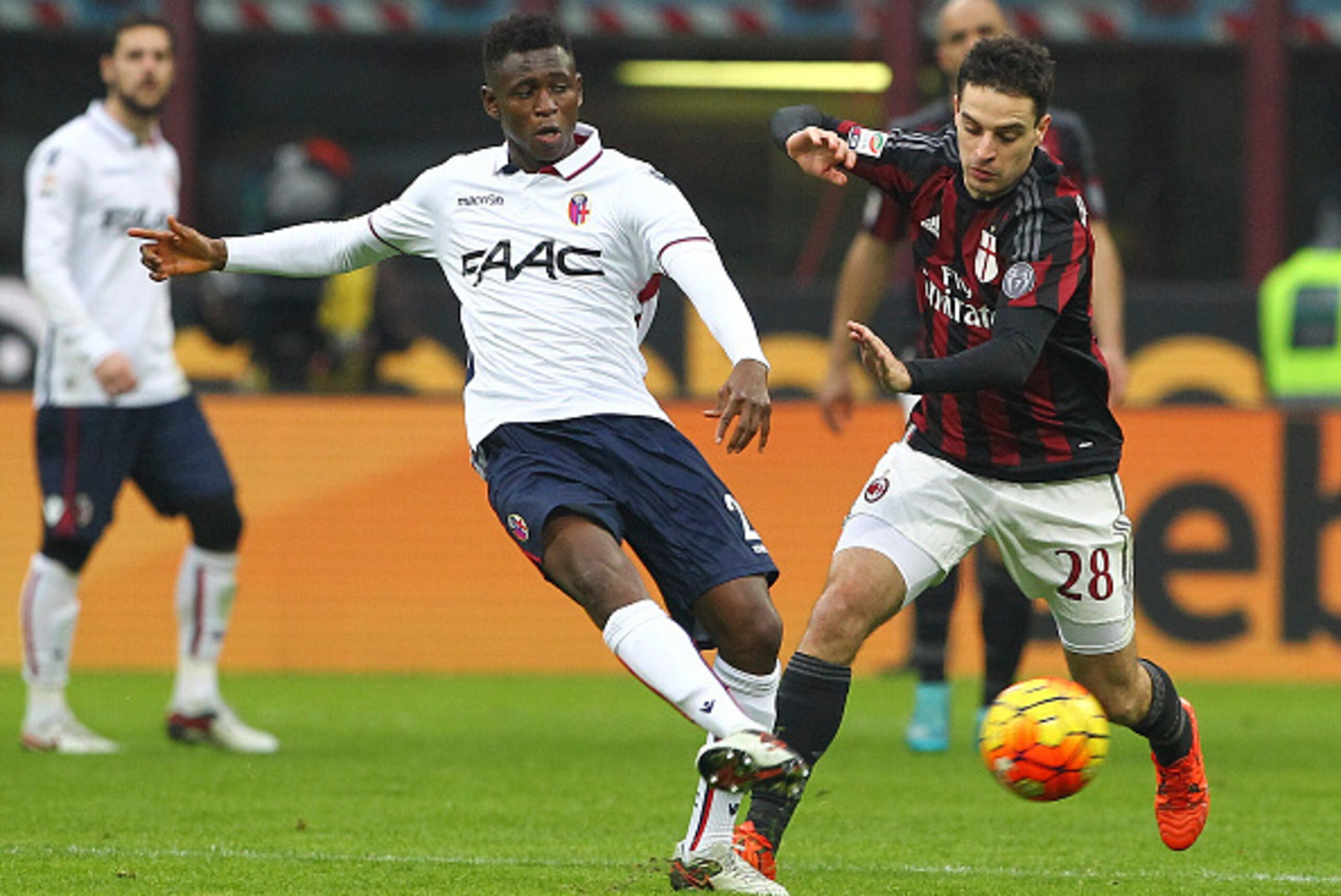 MILAN, ITALY - JANUARY 06: Amadou Diawara of Bologna FC is challenged by Giacomo Bonaventura of AC Milan during the Serie A match between AC Milan and Bologna FC at Stadio Giuseppe Meazza on January 6, 2016 in Milan, Italy. (Photo by Marco Luzzani/Gett MILAN, ITALY - JANUARY 06: Amadou Diawara of Bologna FC is challenged by Giacomo Bonaventura of AC Milan during the Serie A match between AC Milan and Bologna FC at Stadio Giuseppe Meazza on January 6, 2016 in Milan, Italy. (Photo by Marco Luzzani/Gett