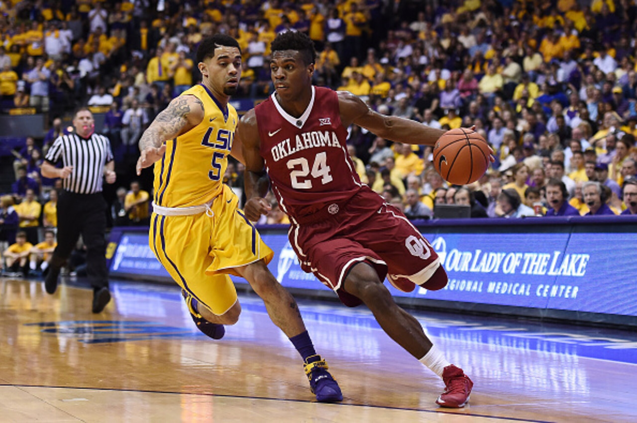 BATON ROUGE, LA - JANUARY 30:  Buddy Hield #24 of the Oklahoma Sooners works against Josh Gray #5 of the LSU Tigers during a game at the Pete Maravich Assembly Center on January 30, 2016 in Baton Rouge, Louisiana. Oklahoma defeated LSU 77-75.  (Photo by S