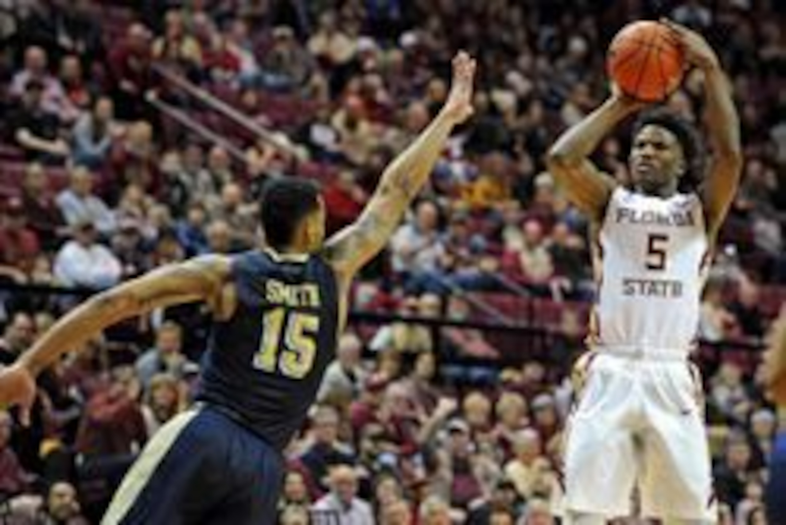 Jan 23, 2016; Tallahassee, FL, USA; Florida State Seminoles guard Malik Beasley (5) shoots the ball past Pittsburgh Panthers guard Sterling Smith (15) during the second half at the Donald L. Tucker Center. Mandatory Credit: Melina Vastola-USA TODAY Sports