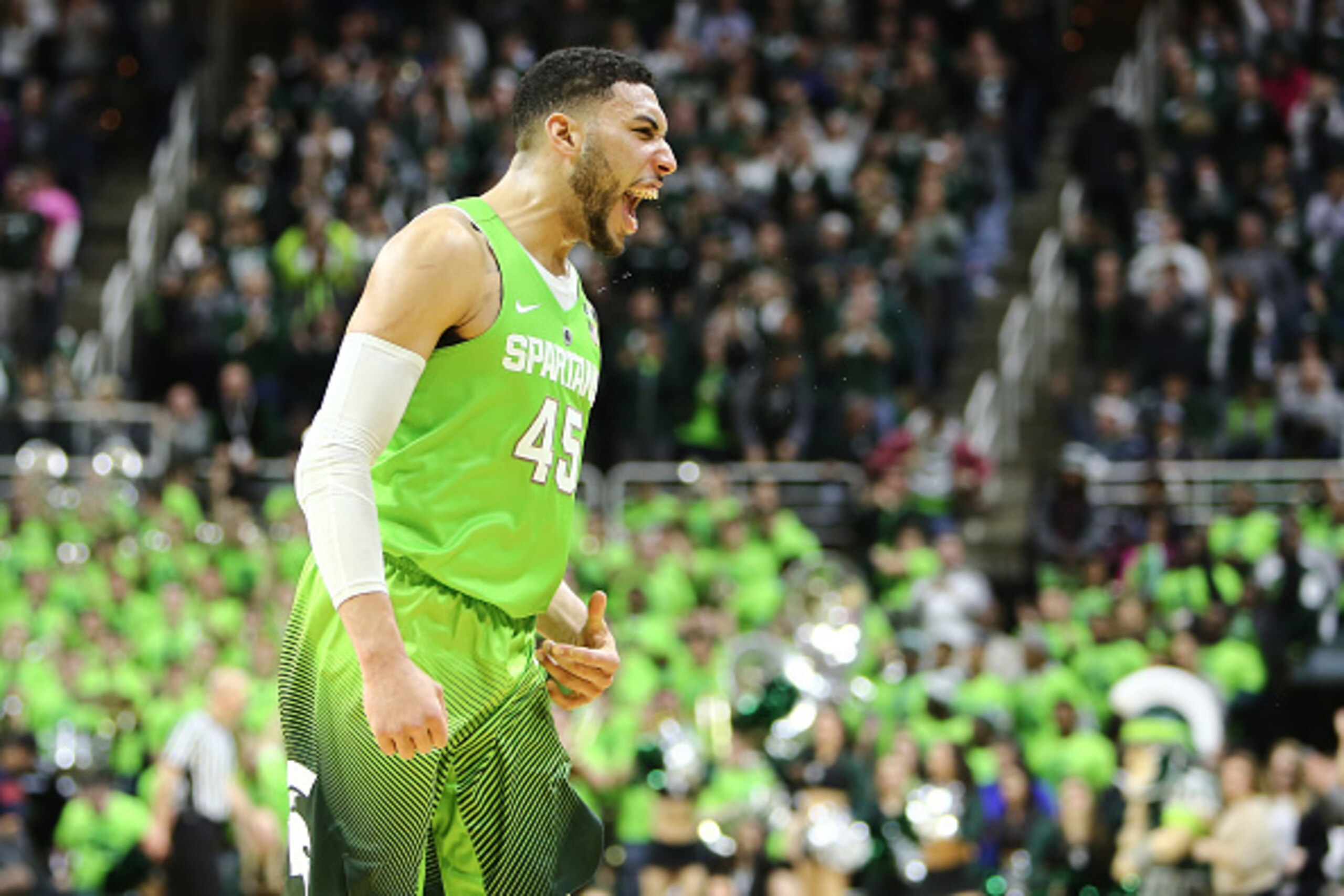 EAST LANSING, MI - JANUARY  23:  Denzel Valentine #45 of the Michigan State Spartans celebrates after defeating Maryland Terrapins 74- 65 at the Breslin Center on January 23, 2016 in East Lansing, Michigan. (Photo by Rey Del Rio/Getty Images)
